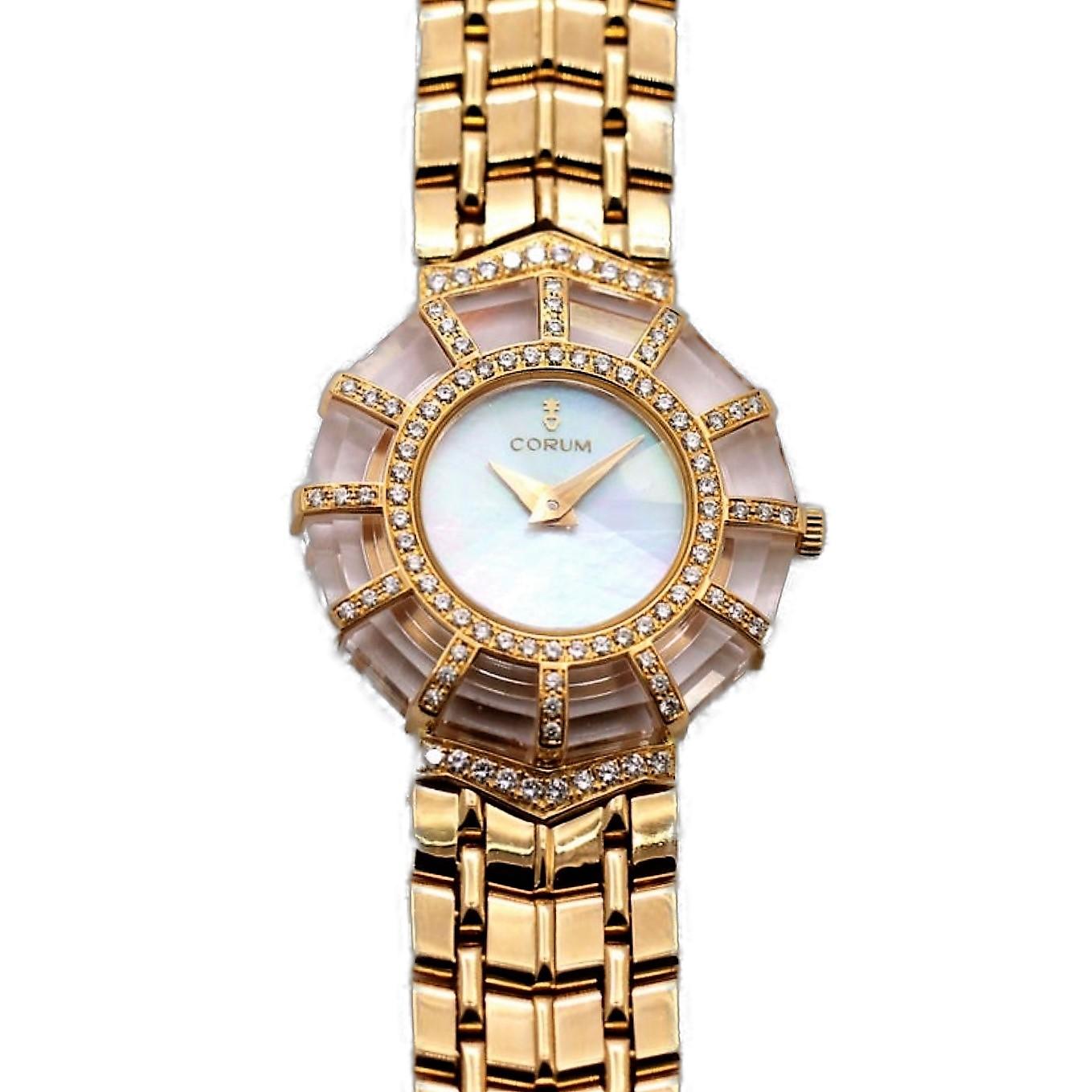 An 18K yellow gold ladies wristwatch, centered around a mother of pearl dial. The bezel is set with assorted round brilliant cut diamonds, that radiate out with 12 spokes of yellow gold and diamonds crossing over step-cut rock crystal. The lugs of