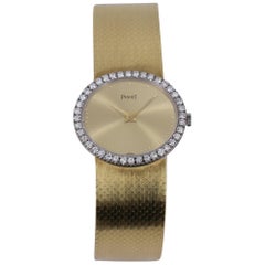 Ladies Gold Piaget Watch with Champagne Dial and Diamond Bezel