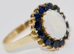 Ladies Gold Ring with Big Opal and Blue Sapphires