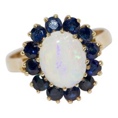 Ladies Gold Ring with Big Opal and Blue Sapphires
