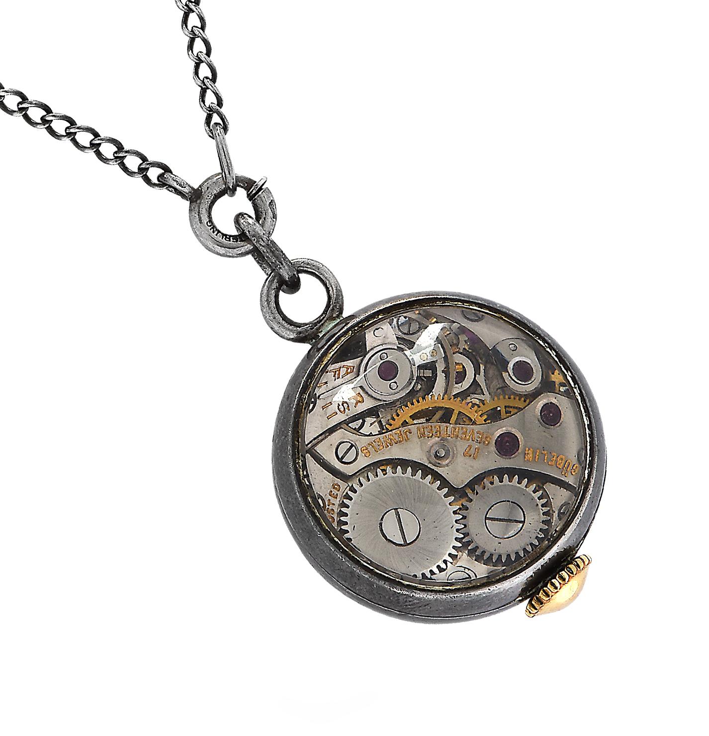 Ladies manual wind Gubelin watch with 17 jewels and a museum back suspended from a 18.5 inch sterling silver chain. 

Our pieces are all accompanied by an appraisal performed by one of our in-house GIA Graduates. They are also accompanied by GIA