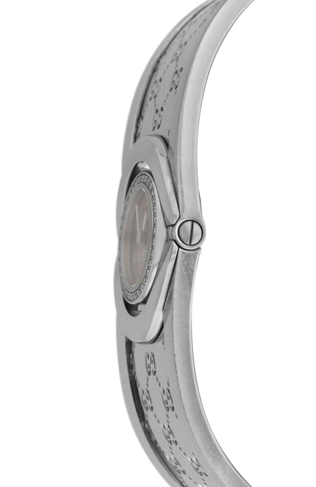 Brand	Gucci
Model	Twirl 112
Gender	Ladies
Condition	Pre owned
Movement	Swiss Quartz
Case Material	Stainless Steel
Bracelet / Strap Material	
Stainless Steel

Clasp / Buckle Material	
Stainless Steel	
Clasp Type	Jewelry clasp
Bracelet / Strap