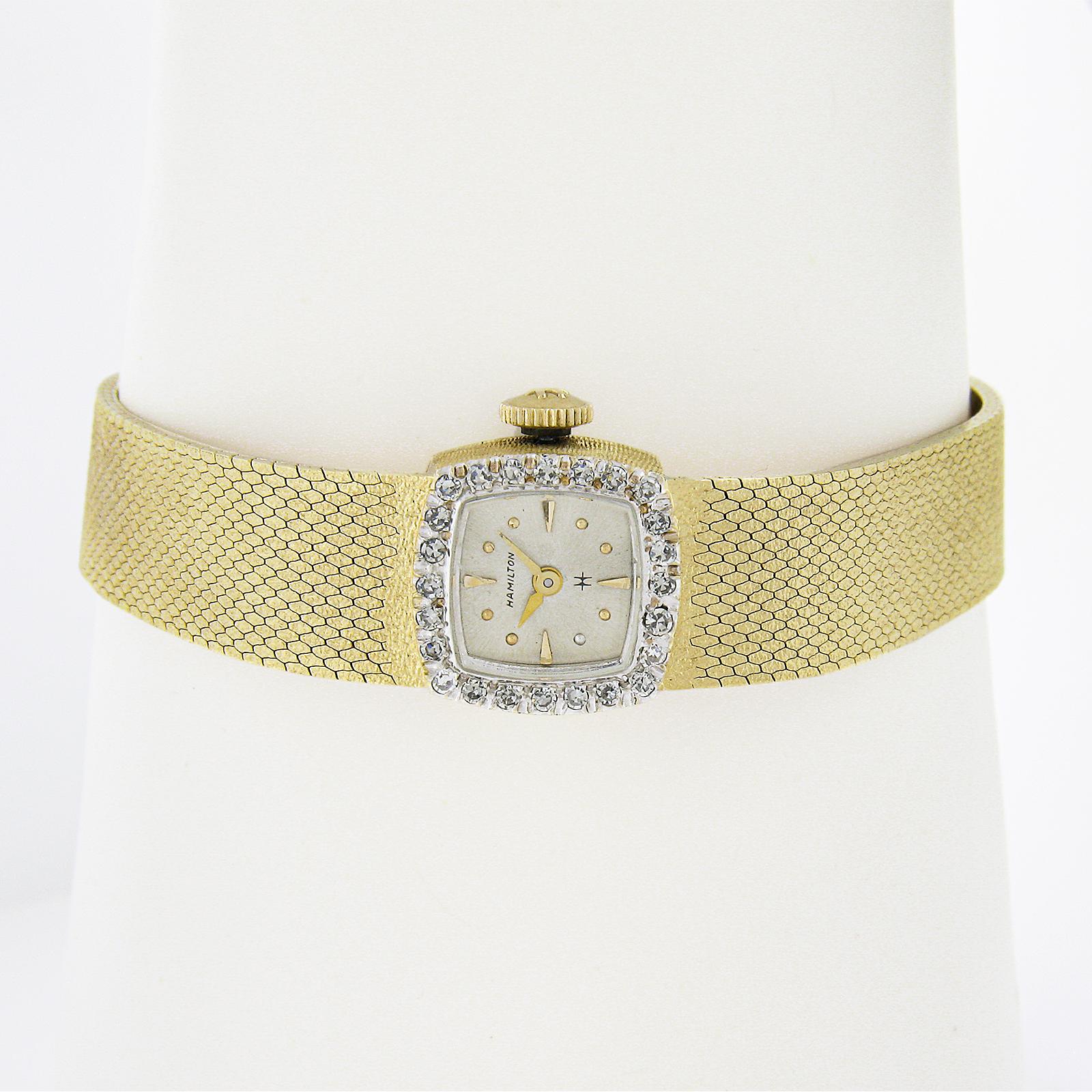 Watchmaker: Hamilton
Movement: Mechanical Hand Winding - 22 Jewels - Caliber 767
Case Material: Solid 14k Yellow Gold
Case Width: 14mm (not counting the crown)
Case Thickness: 7.4mm
Bracelet:	Textured Solid 14k Yellow Gold
Bracelet Length: Will