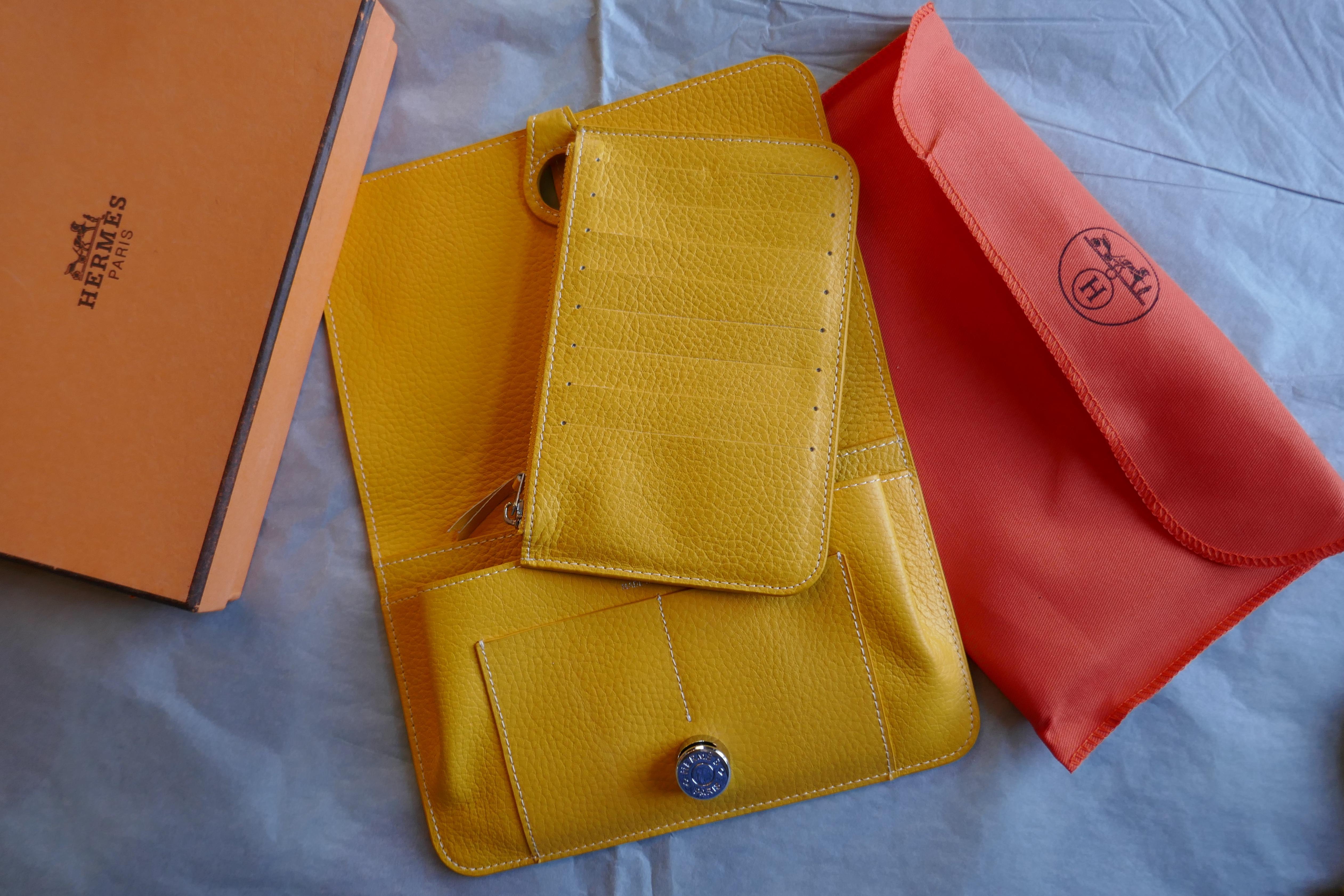 Ladies Hermes Yellow Togo Calfskin Dogon Duo Wallet with Purse  This beautiful wallet is made from Togo Calfskin and has a silver coloured metal fastening with a leather slide tab, reading 'HERMÈS PARIS’  The wallet has 2 sections, the front with 3