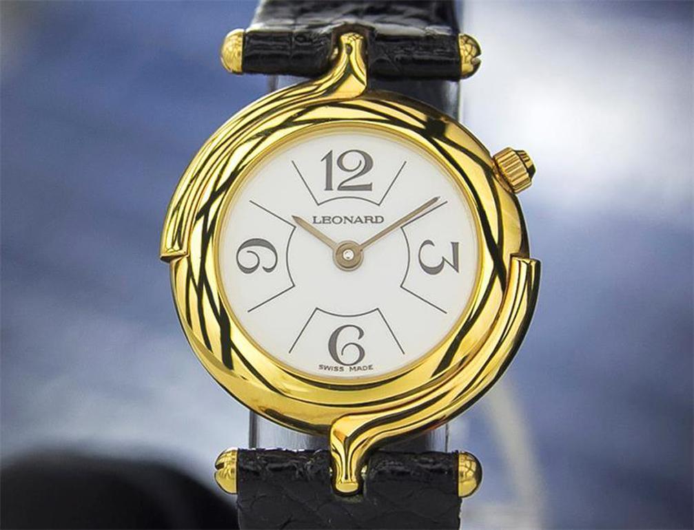 Classic elegance, Ladies Leonard gold-plated quartz dress watch, c.2000s, with original tag. Verified authentic by a master watchmaker. Gorgeous Leonard signed off-white, creamy dial, quarterly Arabic numeral hour markers, gilt minute and hour