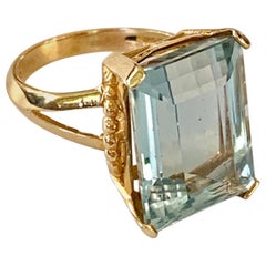 Ladies Light Blue Emerald cut Topaz 14 Karat Yellow Gold Ring