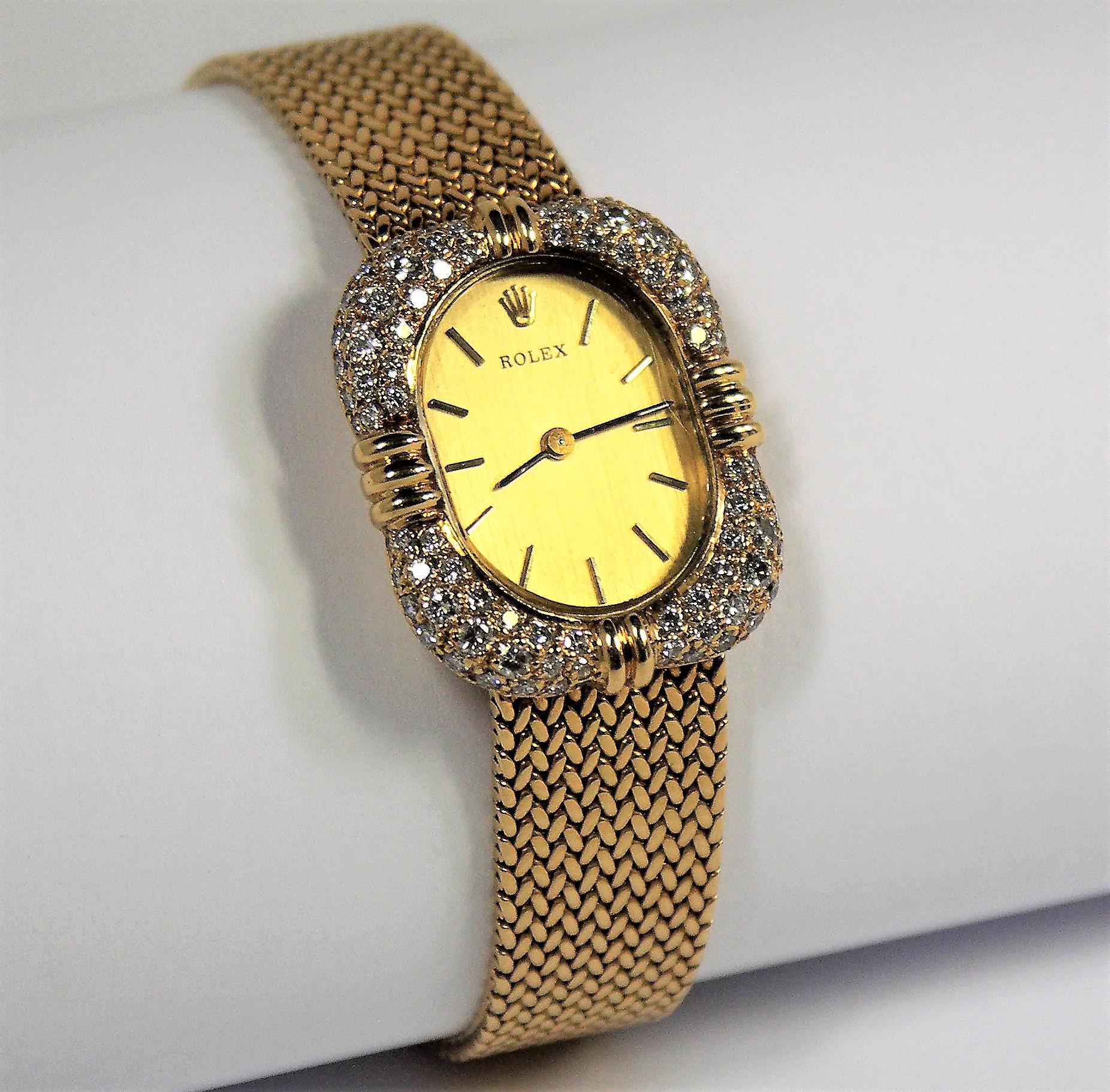 The elegant, all factory original, diamond encrusted surround of this mid-century ladies dress Rolex, is set with an approximate total weight of 3 carats of overall F/G color,  VS1 clarity diamonds. The shape of the diamond encrusted surround is an