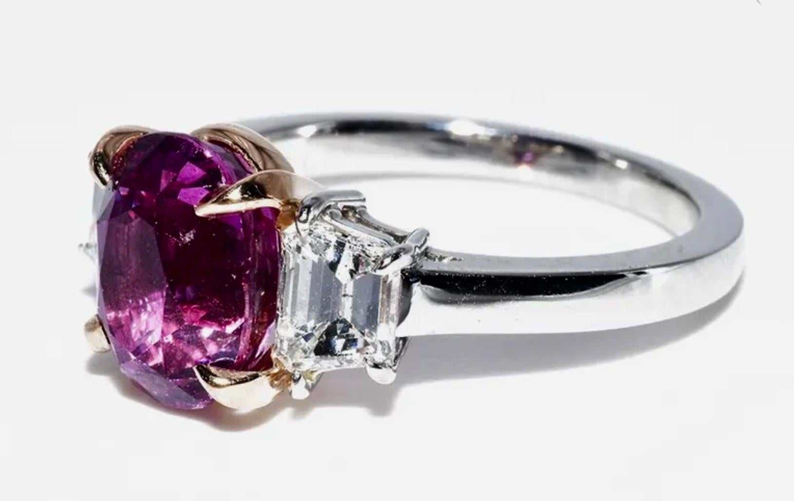 You are looking at a truly breathtaking Pink Sapphire and Diamond three stone engagement ring
 that is newly crafted in solid platinum and 18K Y.G. The ring features a truly gorgeous!

AGL Certified:
This super elegant and classy three stone ring is