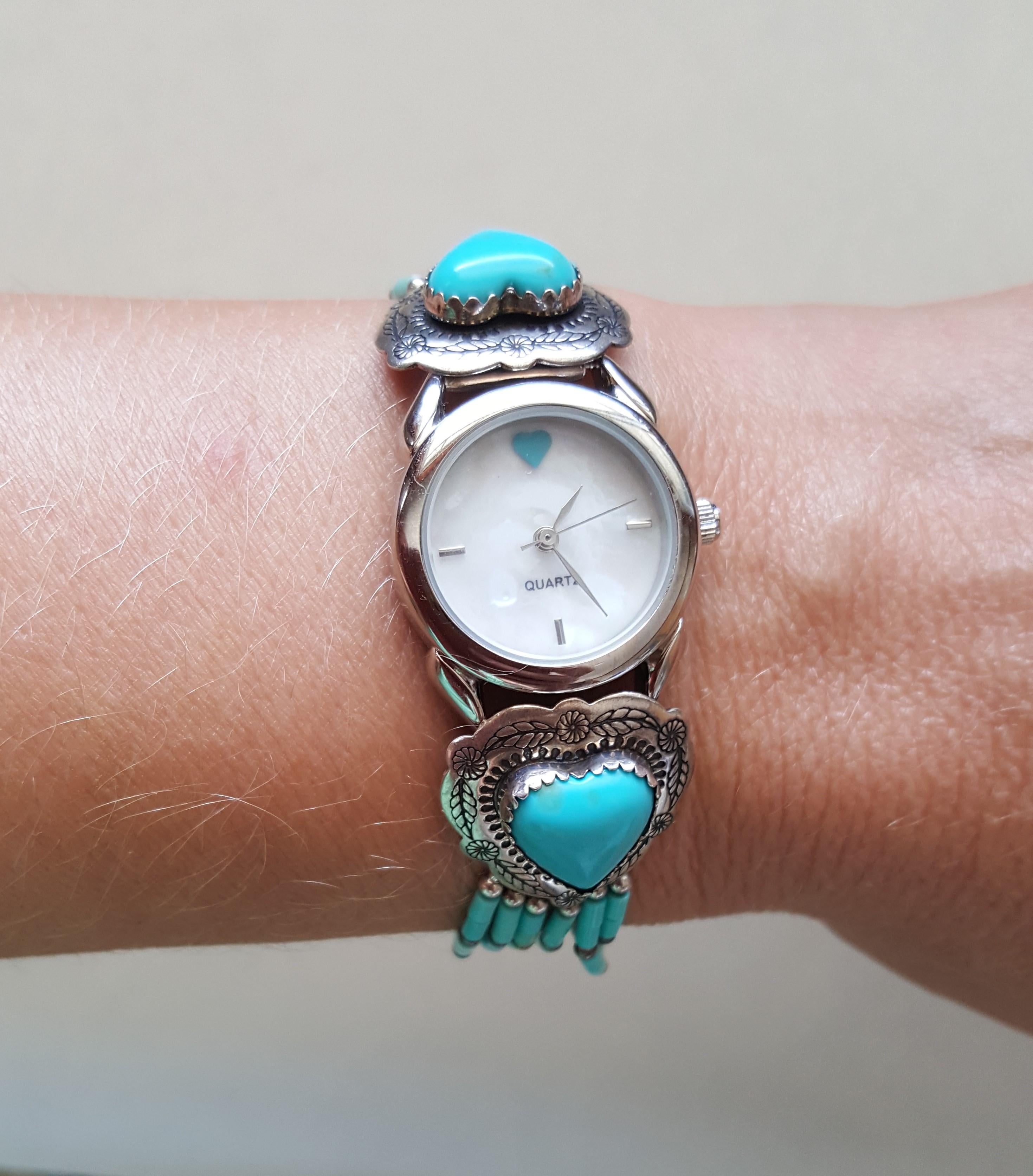 Ladies Navajo American Indian  925  Silver Heart Turquoise Watch, Quartz, Working, Mother of Pearl Face, Sgned Canyon De Chelly, New, 24mm. Signed with Designer Stamp.

Watch has a  heart at the 12 o' clock, weighs 25.09 grams, up to 7 inch plus