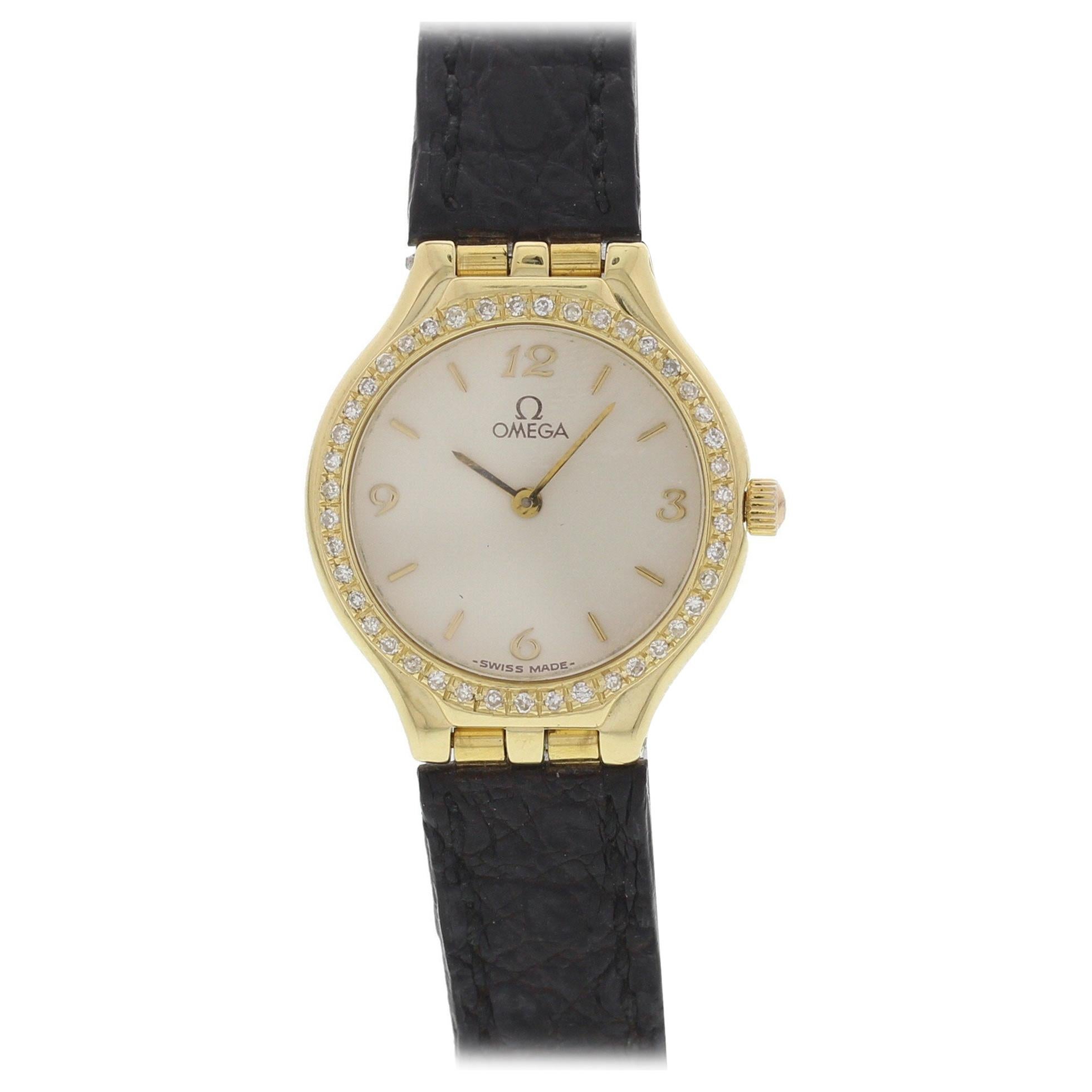 Ladies Omega 18 Karat Yellow Gold Diamond Bezel Watch For Sale