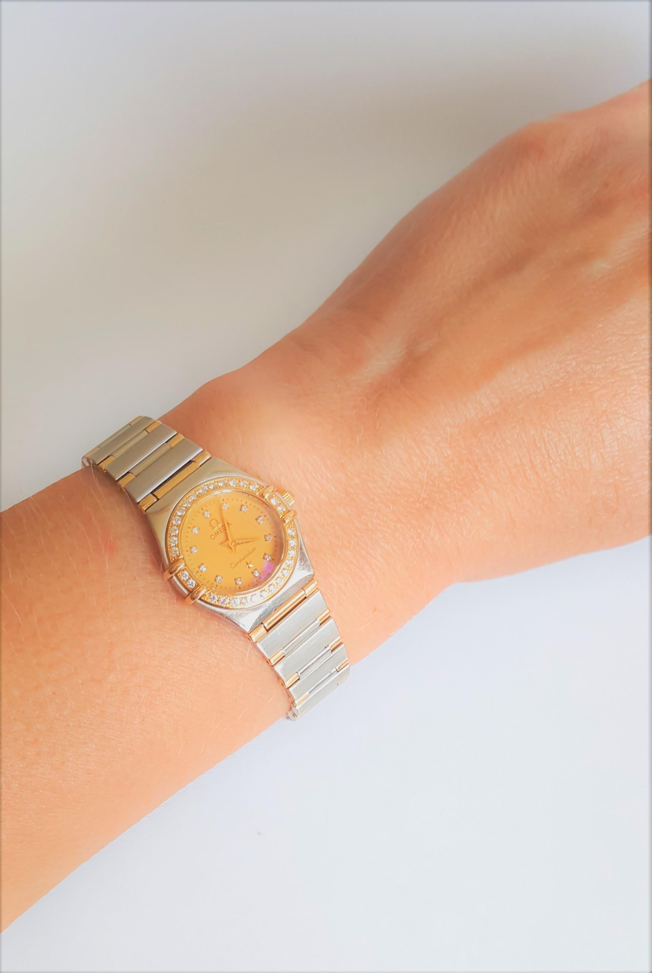 Ladies Omega Constellation 18kt yellow and stainless steel watch. This watch has just been fully serviced and in good working condition. The case is 24mm in diameter and is adorned with round diamonds on the bezel and dial; there are 42 diamonds