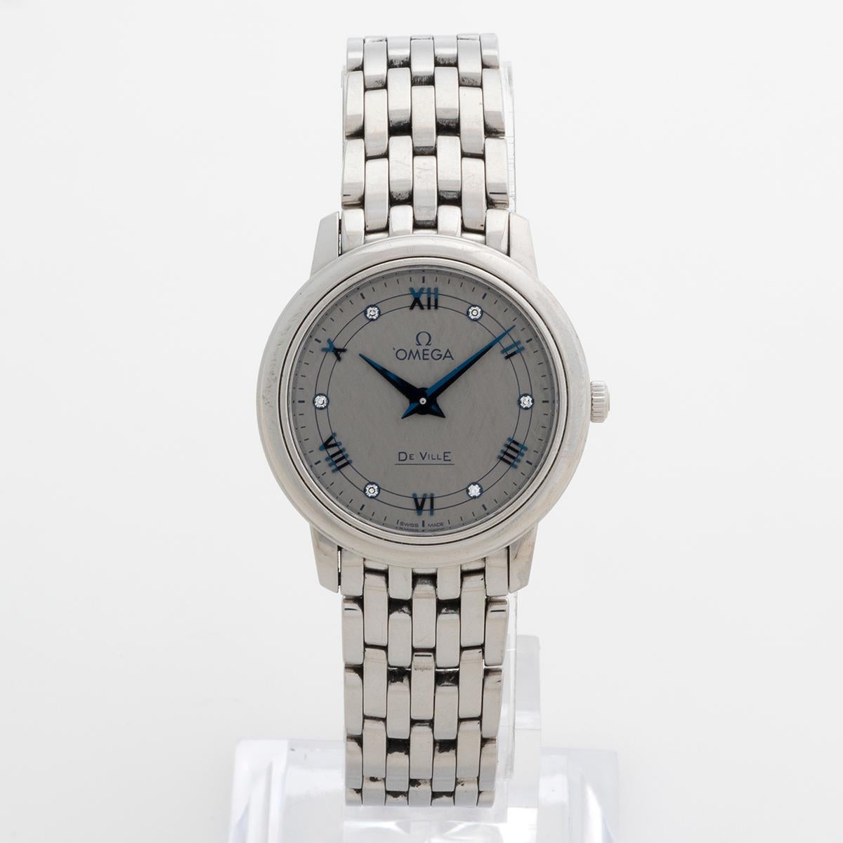 Our lovely ladies quartz Omega De Ville Prestige reference 42410276056002 , features a 27.4mm stainless steel case, stainless steel bracelet and grey dial with blue indices and six diamonds. Presented in excellent condition with only light signs of