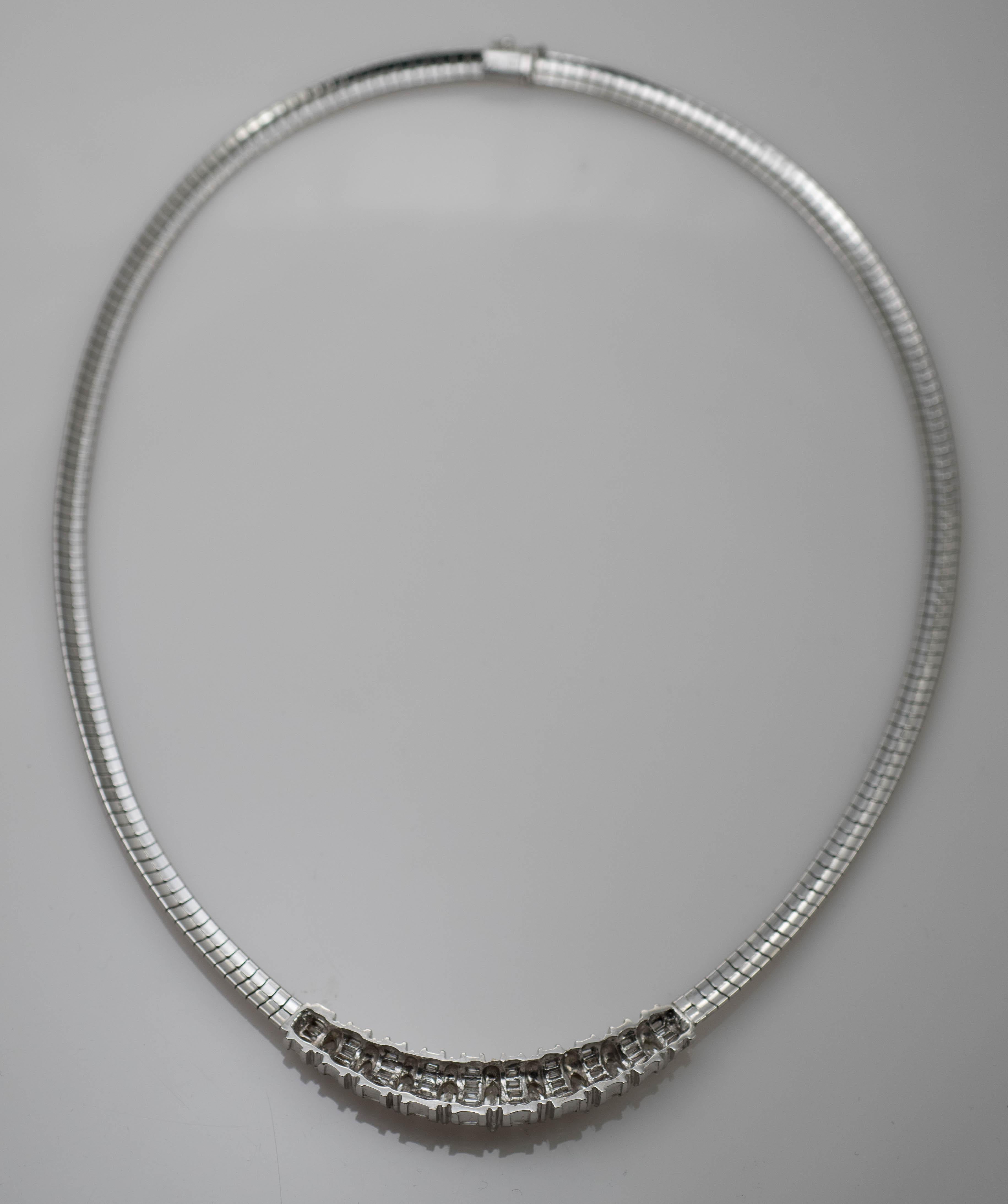 Ladies Omega Link Necklace With Diamonds In 14 karat White Gold.
Stamped 14k And Weighs 39.3 Grams.
There Are 9 Marquise Shape Diamonds, 1.50 Total Carats, I To J Color, Vs Clarity, Good Cuts.
There Are Baguette Shape Diamonds in between, 3.00 Total