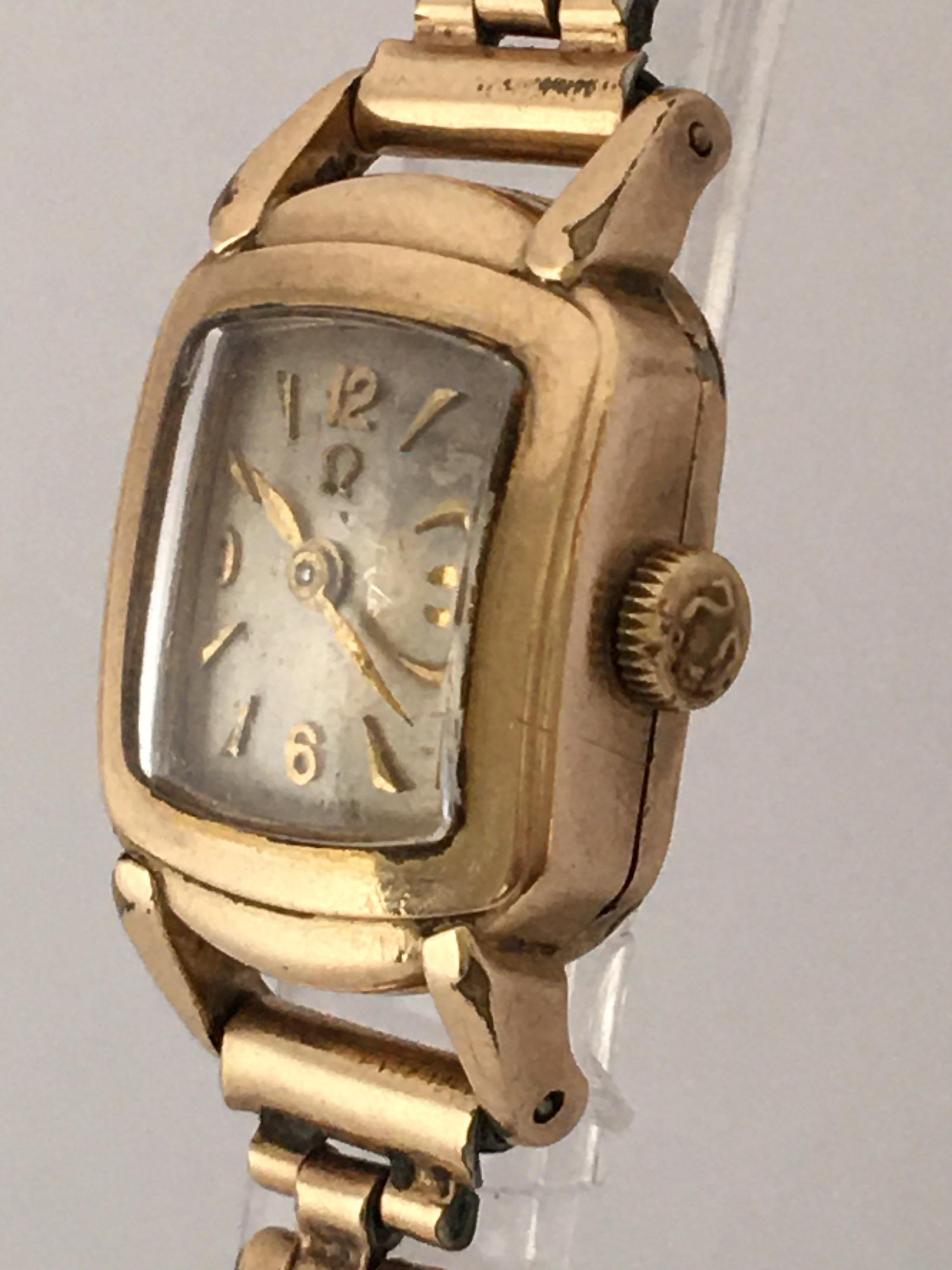 This beautiful and tiny gold plated vintage hand winding watch is working and is running well. Visible signs of wear and ageing with the silvered watch dial is a bit worn. some light tiny scratches on the glass and on the watch case. The gold plated