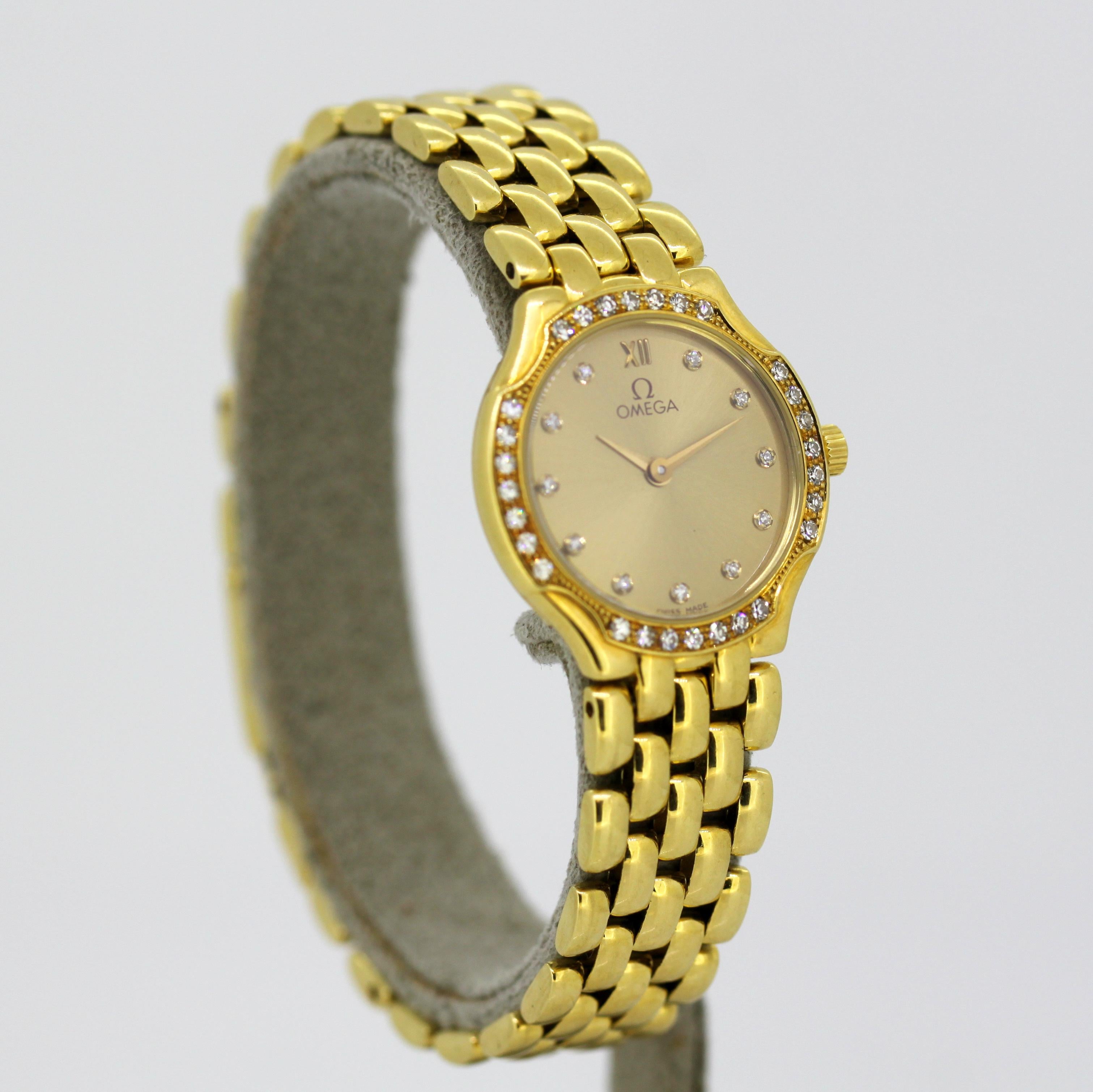 Women's Ladies Omega wristwatch set in full 18k gold, diamond bezel & hour markers