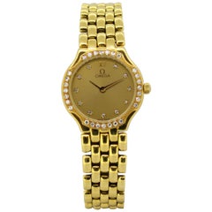 Vintage Ladies Omega wristwatch set in full 18k gold, diamond bezel & hour markers