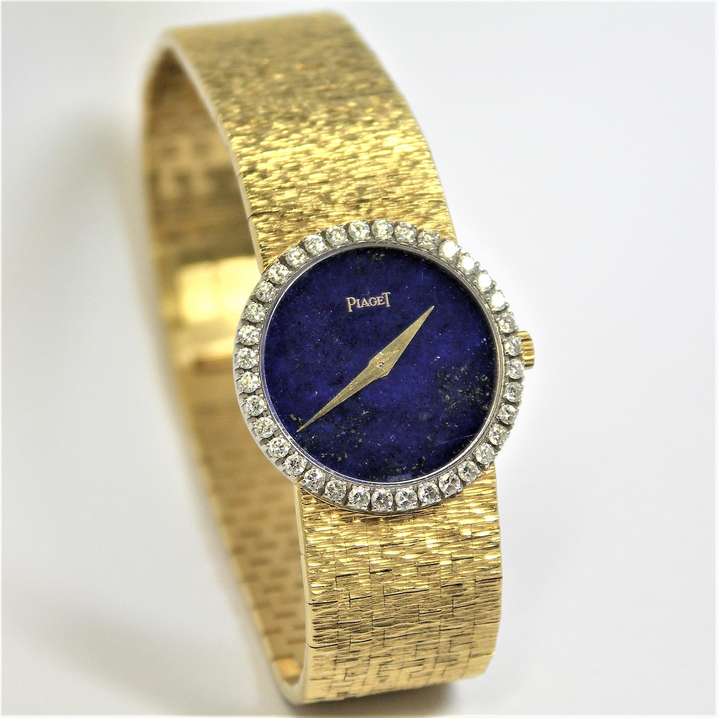 Made of 18K Yellow Gold with a round, lapis lazuli dial surrounded by diamonds
weighing an approximate total of 1.00CT, this lovely Piaget watch would be a welcome addition to any lady's collection. The bark finish band is crisp and is in
very good