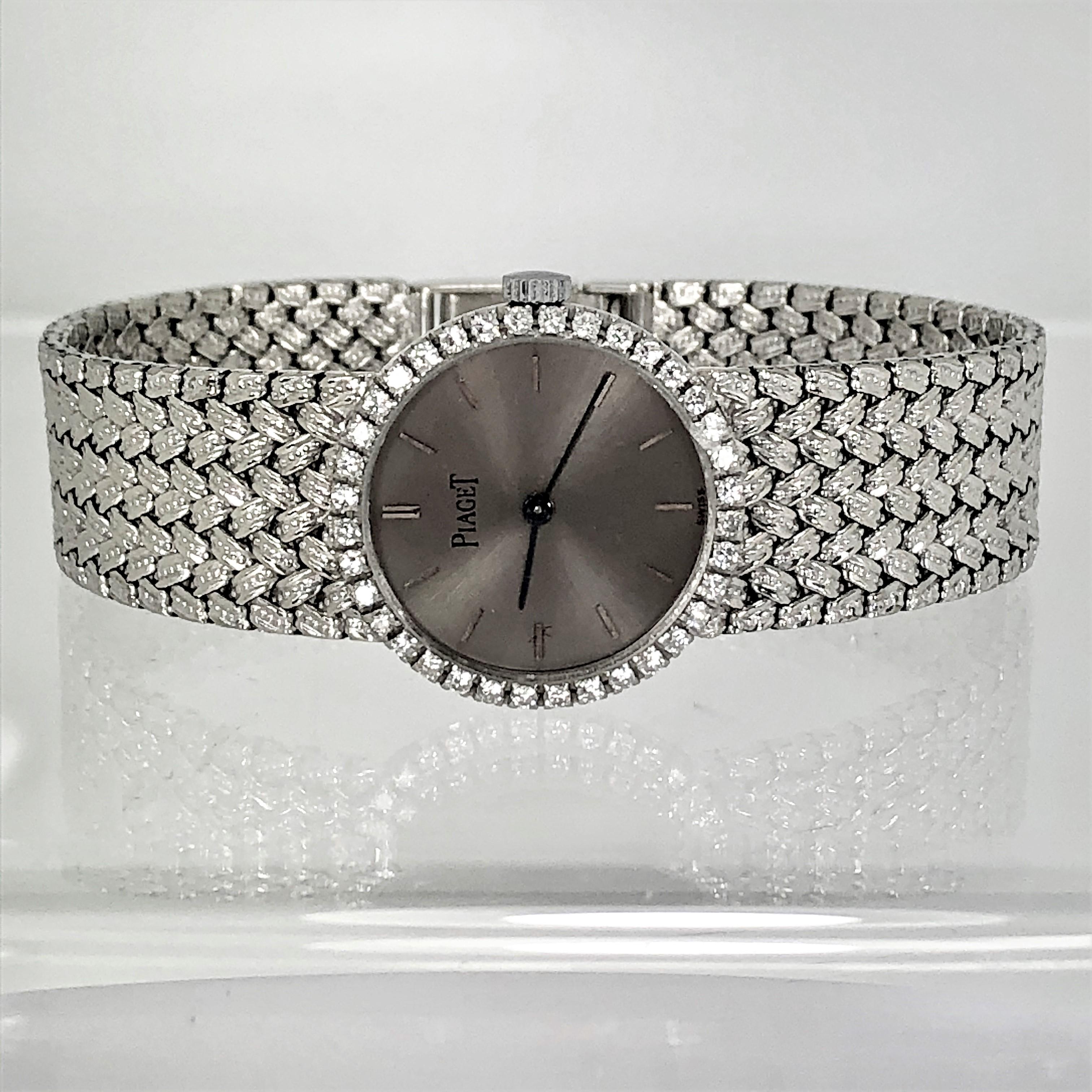 A ladies 18K white gold Piaget wristwatch featuring a slate grey metal dial 
with raised bar markers. Surrounding the dial is a bezel set with 36 round
brilliant cut diamonds weighing an approximate total of .75CT of overall
F Color and VS1 Clarity.