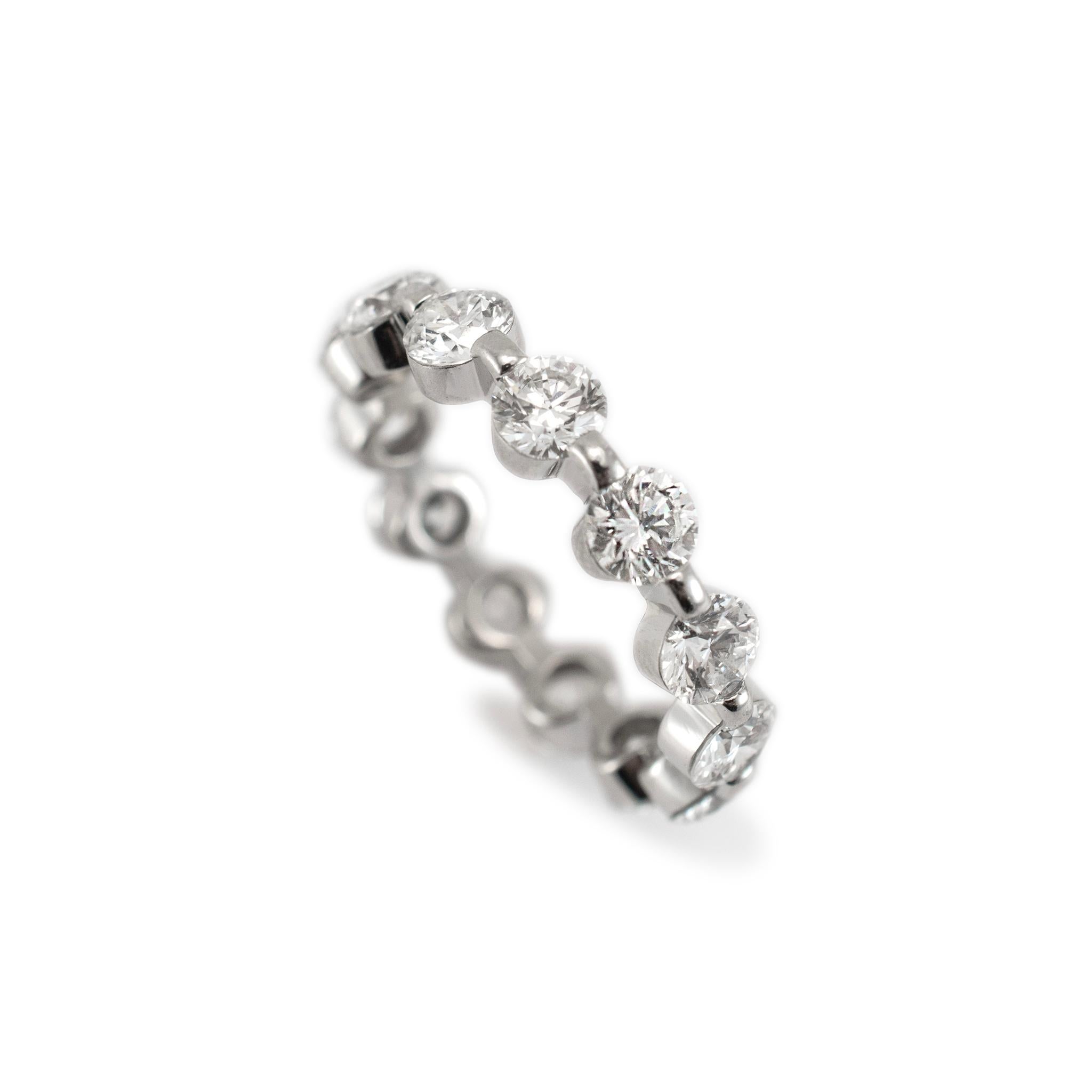 Gender: Ladies 

Metal Type: Platinum

Ring Size: 7 

Width: 4.00 mm 

Weight: 5.41 grams

One ladies platinum diamond eternity wedding band with a half-round shank. The metal was tested and determined to be platinum. In excellent