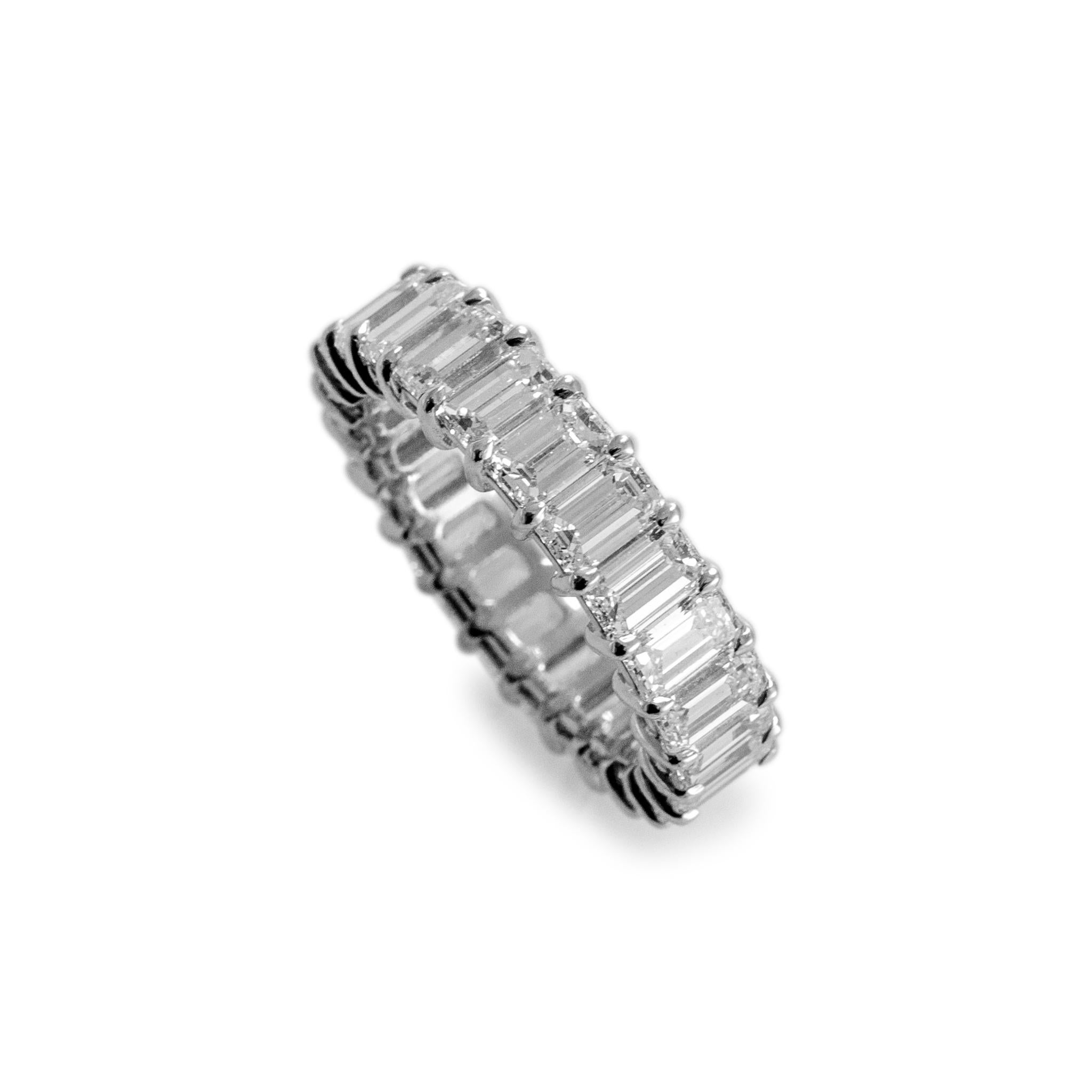 Gender: Ladies

Metal Type: Platinum 

Ring Size: 6.5

Width: 5.40 mm

Weight: 5.76 grams

Platinum diamond wedding eternity band with a soft-square shank. The metal was tested and determined to be platinum. Engraved with 