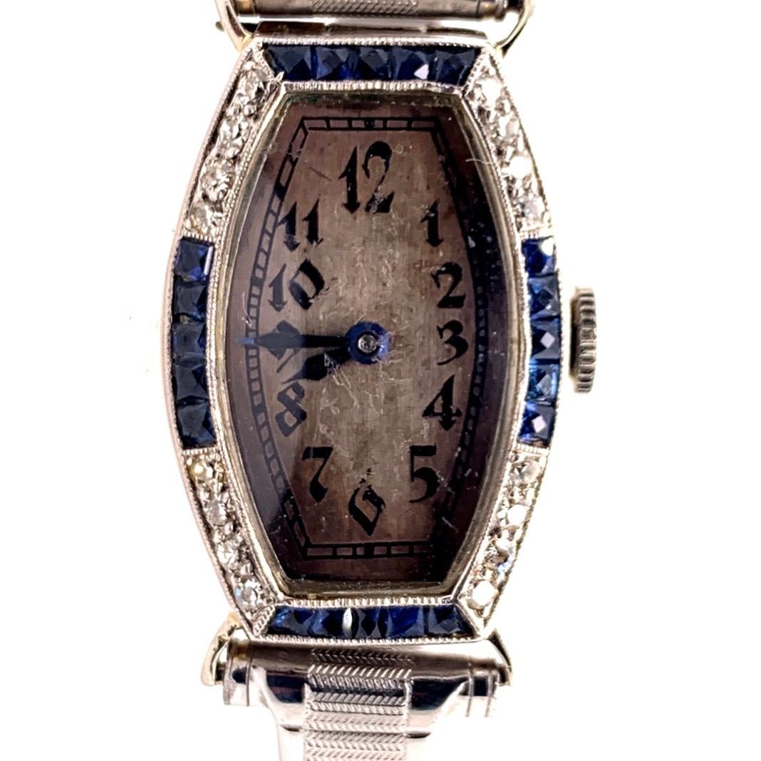 Rare Vintage Ladies Collectable Longines Movement, platinum top and 18k White Gold caseback. Natural Diamonds & Sapphires, Manual Wind Watch. 

It is set with 16 natural colorless diamonds and 20 Natural deep blue sapphires. The watch as pictured