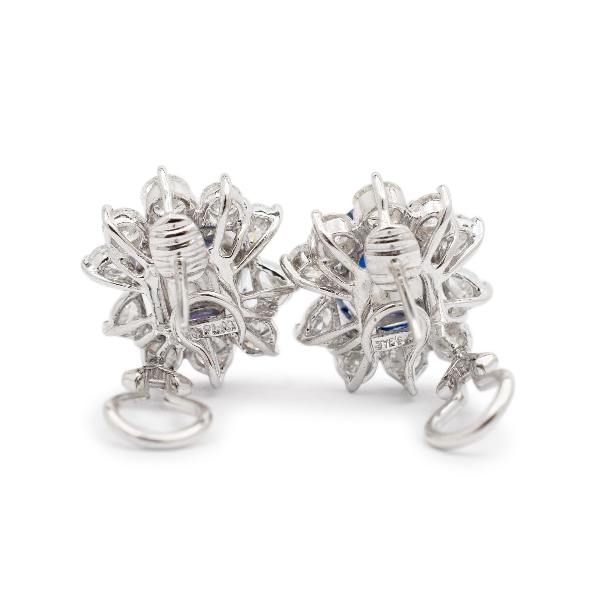 Gender: Ladies

Metal Type: Platinum & 18K White Gold

Length: 0.50 mm

Width: 16.95 mm

Weight: 18.14 grams

Ladies platinum and 18K white gold diamond and sapphire drop halo earrings with 