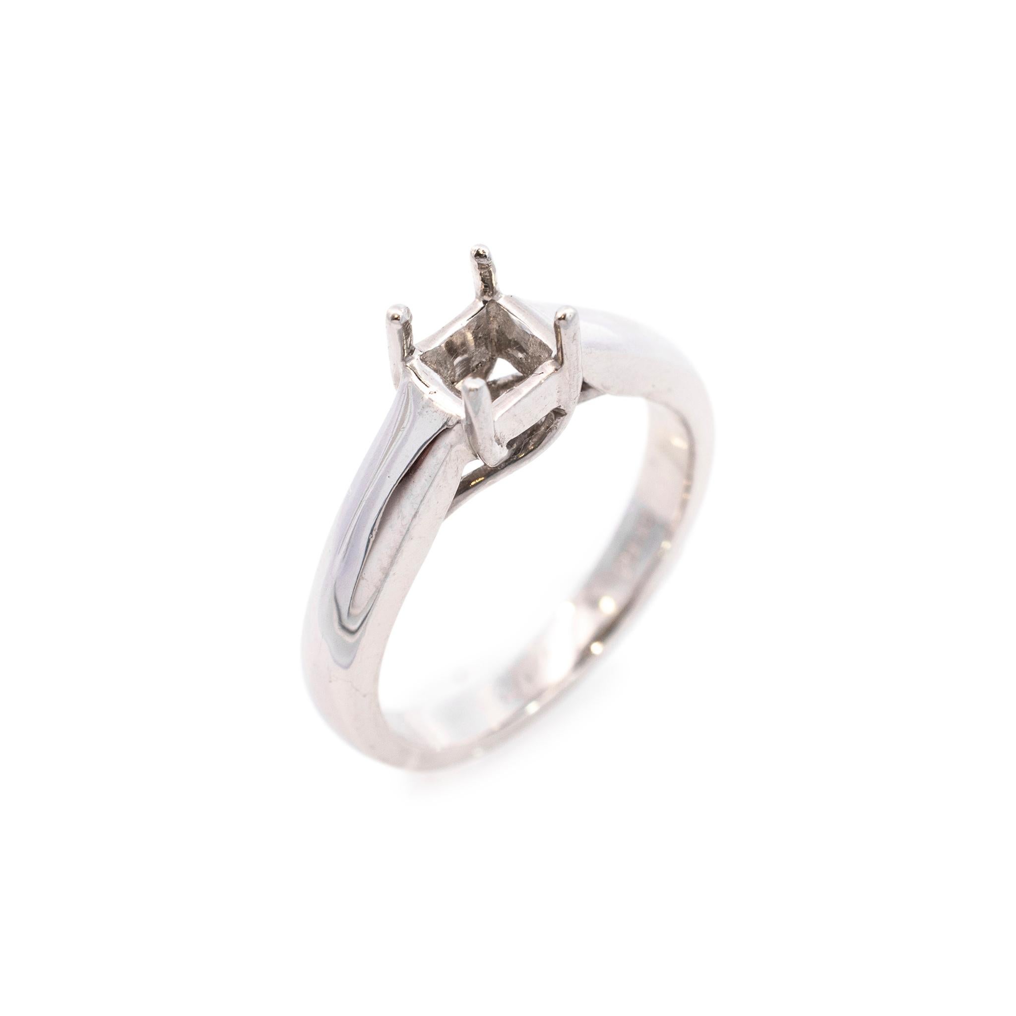 One lady's custom made polished platinum, solitaire engagement, semi-mount ring with a soft-square shank. The ring is a size 6.5. The ring weighs a total of 8.40 grams. Engraved with 