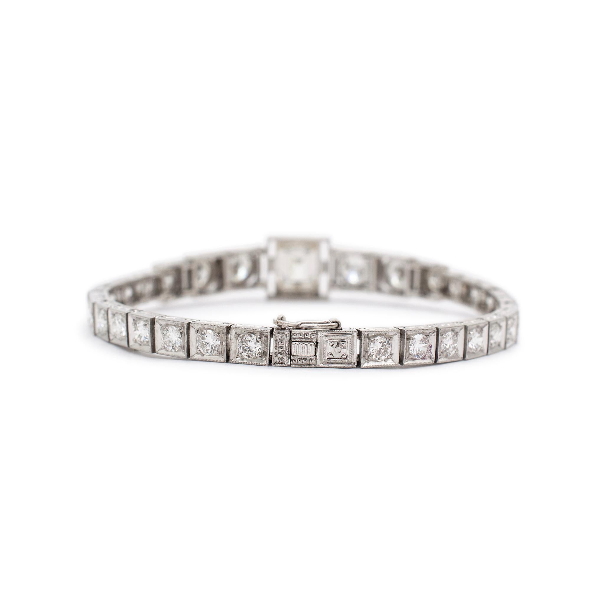 Gender: Ladies

Metal Type: Platinum

Length: 6.50 Inches

Width: 10.05 mm tapering to 4.25 mm

Weight: 21.10 grams
Ladies filigree-style textured platinum diamond contemporary-style tennis link bracelet. The metal was tested and determined to be