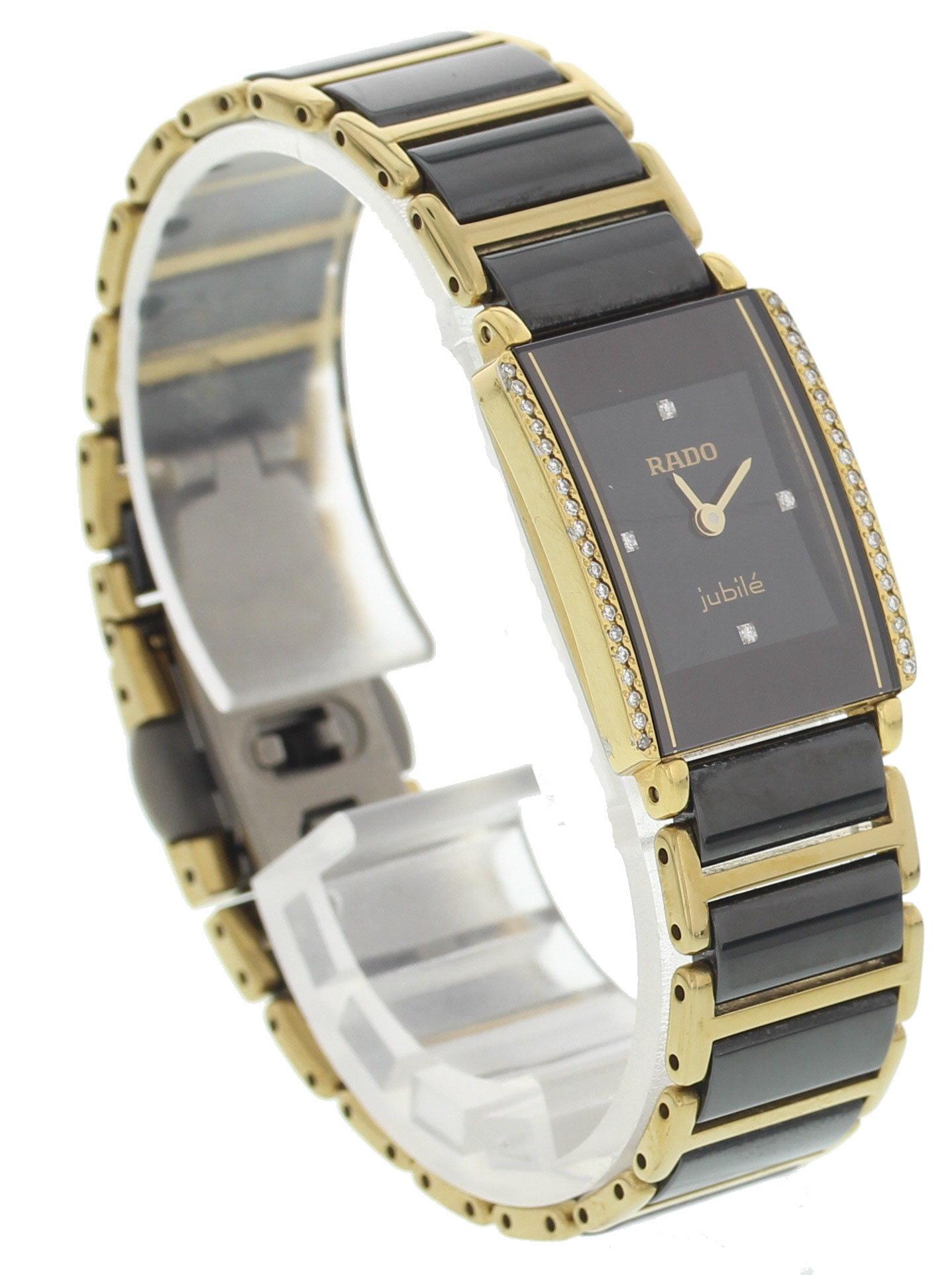 Rado Jubile DiaStar Diamonds 153.0339.3. 19 mm 18k yellow gold case with stainless steel back. 18k yellow gold bezel with diamonds. Black dial with diamond markers and gold hands. Grey and yellow gold ceramic band with titanium fold over clasp with