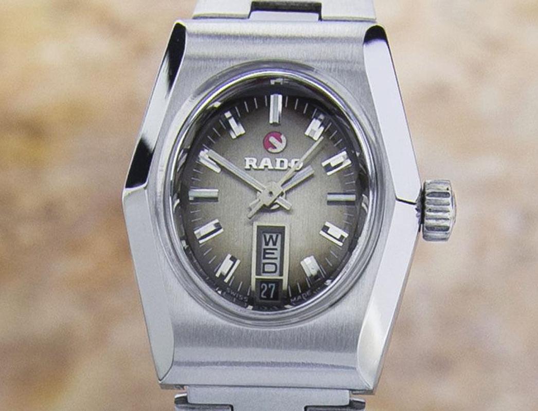 Vintage charm, all stainless steel ladies Rado Shangri-La, c.1960s, all original. Verified authentic by a master watchmaker. Gorgeous Rado-signed bronze dial, applied silver baton hour markers, silver minute and hour hands, central second hand, day