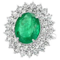 Bague pour dames avec diamants et émeraude