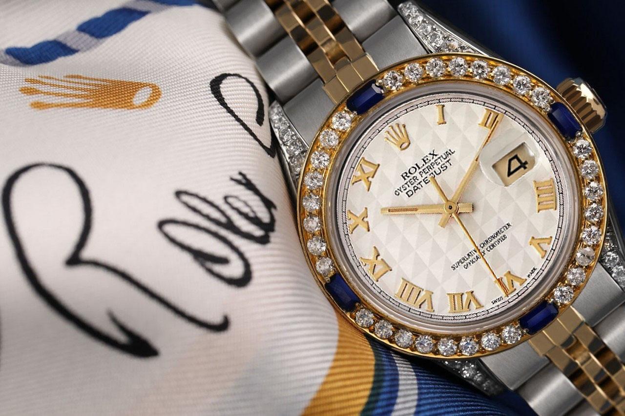 Ladies Rolex 26mm Datejust Cream Pyramid Roman Dial Two Tone Watch Jubilee Band

We take great pride in presenting this timepiece, which is in impeccable condition, having undergone professional polishing and servicing to maintain its pristine