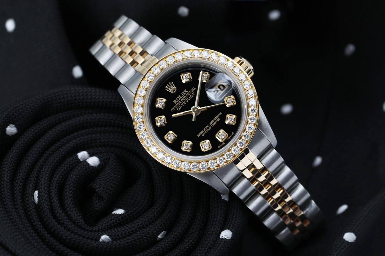 Ladies Rolex 26mm Datejust Vintage Diamond Bezel Two Tone Black Color Dial 69173

This watch is in like new condition. It has been polished, serviced and has no visible scratches or blemishes. All our watches come with a standard 1 year mechanical