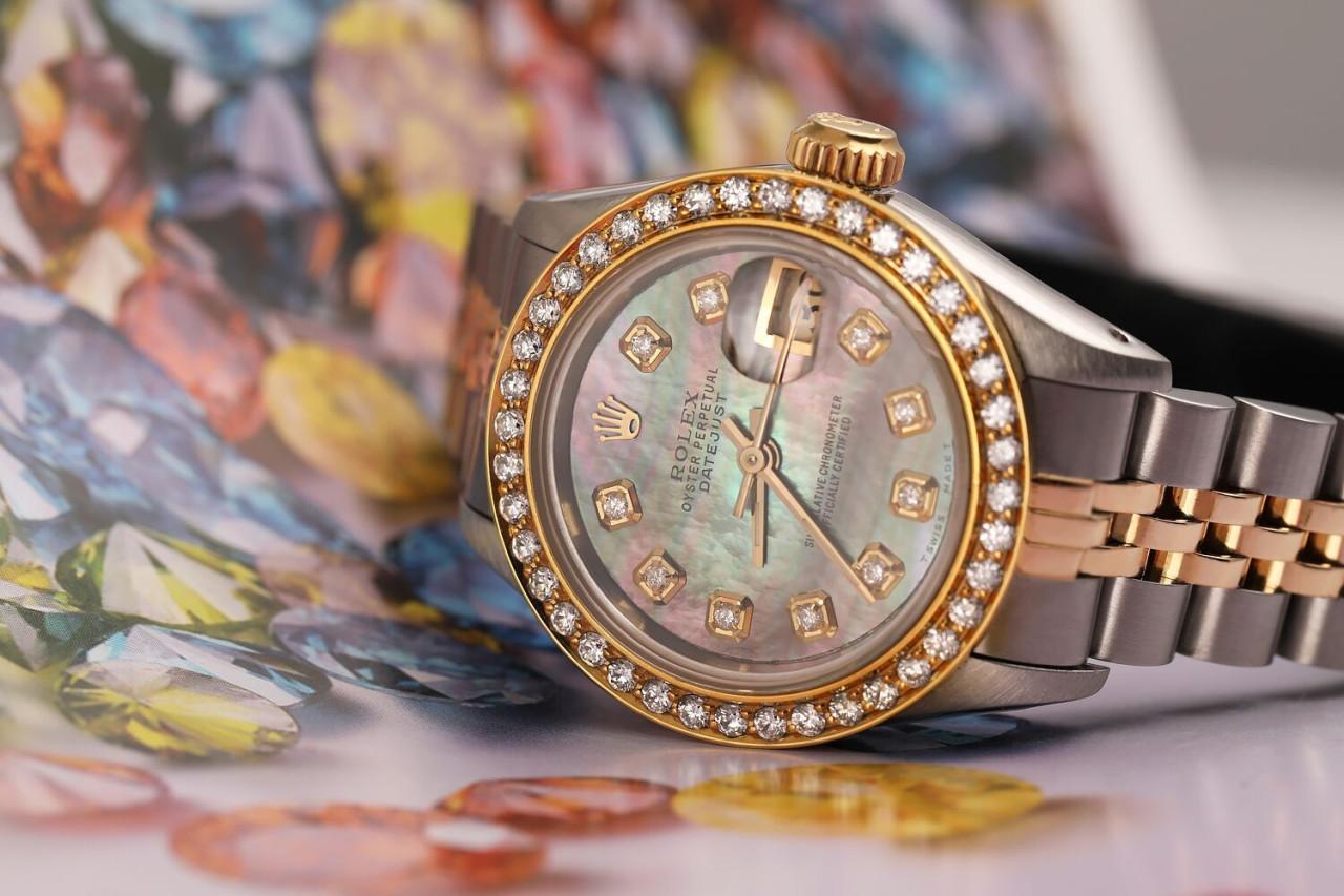 Ladies Rolex 26mm Datejust Vintage Diamond Bezel Two Tone Black MOP Mother Of Pearl Dial with Diamonds 69173

This watch is in like new condition. It has been polished, serviced and has no visible scratches or blemishes. All our watches come with a