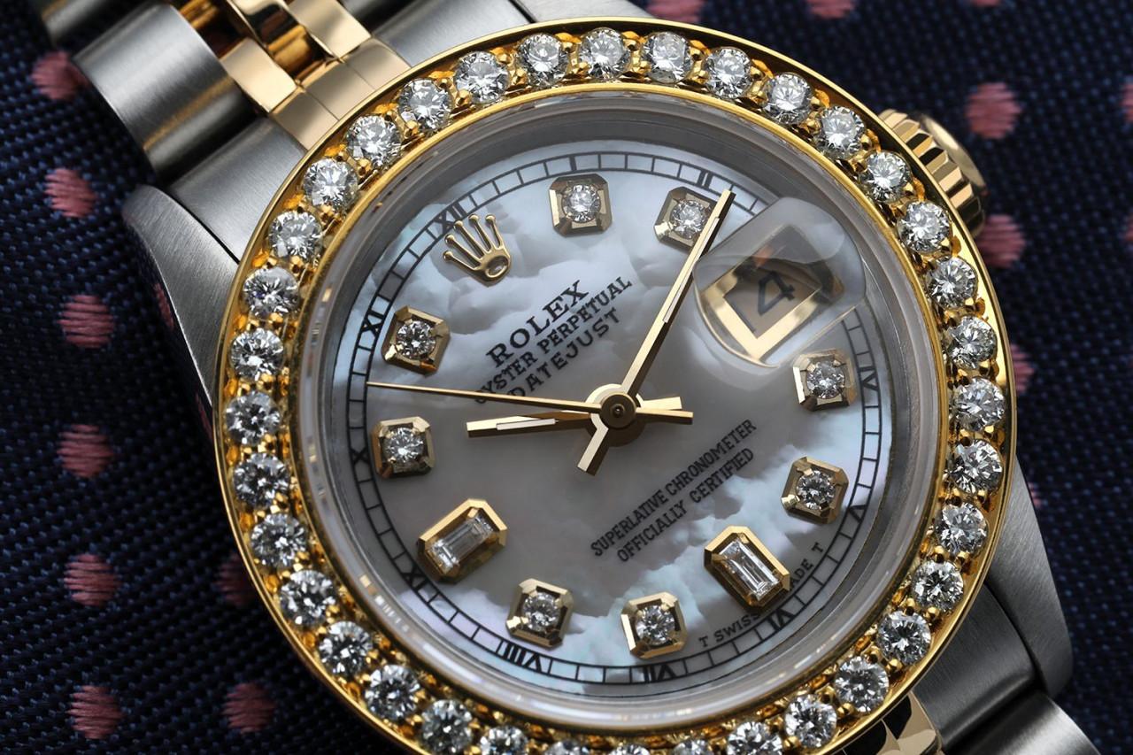 Ladies Rolex 26mm Datejust Vintage Diamond Bezel Two Tone White MOP Mother Of Pearl Dial Diamond Accent 69173

This watch is in like new condition. It has been polished, serviced and has no visible scratches or blemishes. All our watches come with a