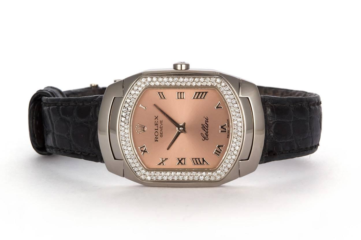 We are pleased to offer this 1991 1999 Ladies Rolex Cellini Cellissima 18k White Gold 6691. It features a pink/rose color dial with raised white gold roman numerals, a factory pave diamond bezel, black Rolex crocodile strap with to 18K white gold