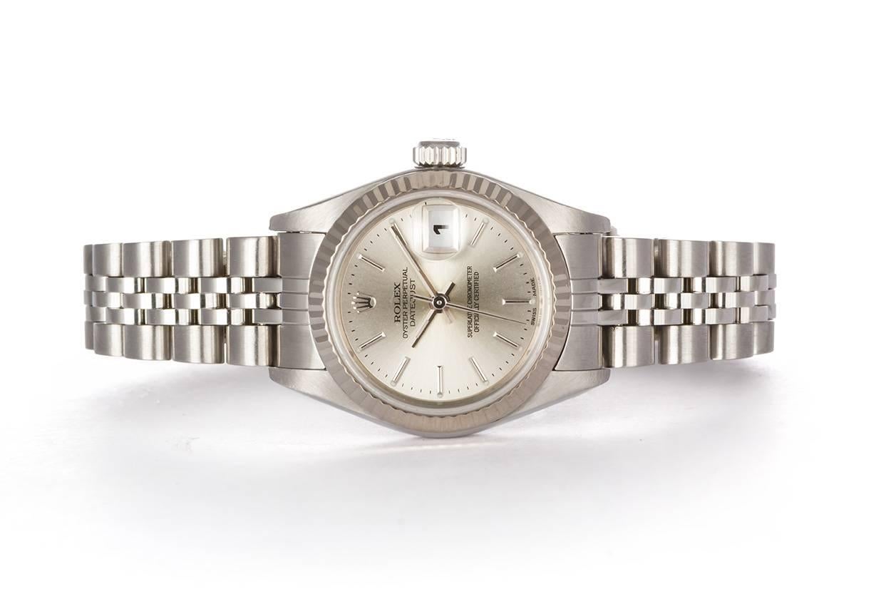 We are pleased to offer this 2003 Stainless Steel 26mm Ladies Rolex Datejust 79174. It is all original Rolex and features an 18k white gold fluted bezel, silver stick dial, stainless steel jubilee bracelet and Rolex automatic movement. It comes with