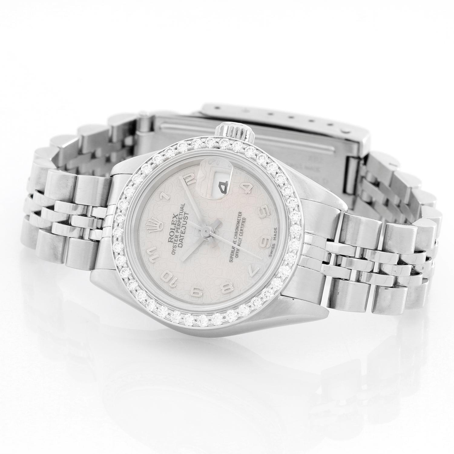 Ladies Rolex Datejust Stainless Steel Watch 79174 - Automatic winding, 31 jewels, quickset, sapphire crystal. Stainless steel case with 18k white gold custom diamond bezel (26mm diameter). Factory cream Jubilee dial with Arabic numerals. Stainless