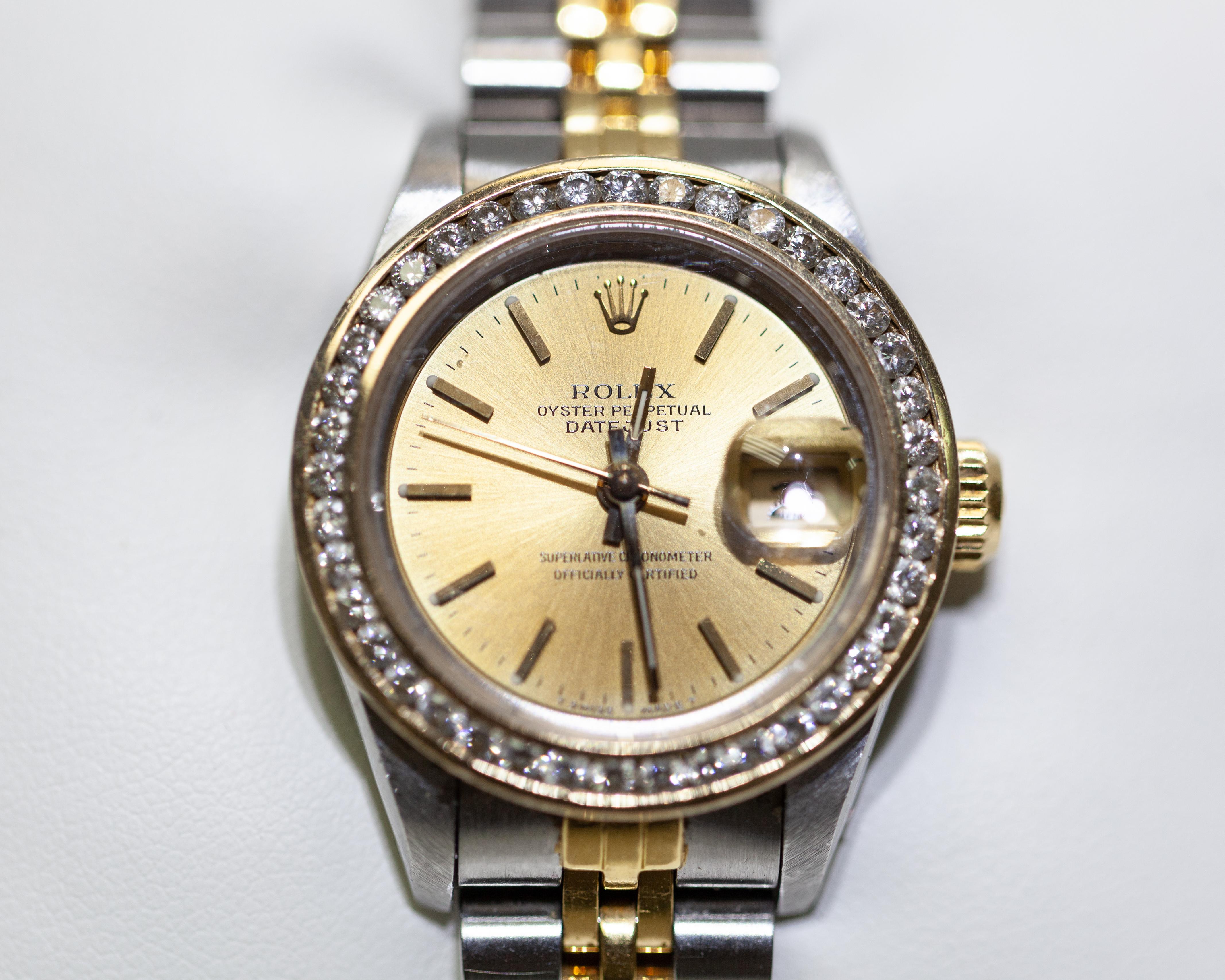 Basic Info 
Listing Number NB00023
Brand Rolex 
Model Datejust
Materials Stainless Steel & 18k Yellow Gold
Bracelet Style Jubilee
Dial Color Gold 
Bezel Fixed Aftermarket Diamonds 
Diamonds 0.03ct x 40=1.2ct total 
28mm Case Size Diameter 
Pre-owned