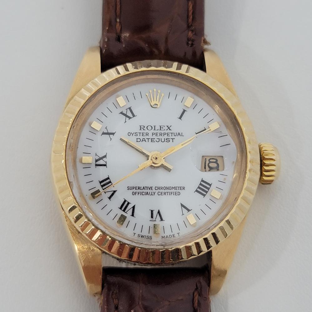 Timeless luxury, Ladies 18k solid gold Rolex Oyster Perpetual Datejust automatic, c.1982. Verified authentic by a master watchmaker. Gorgeous Rolex signed polar white dial, applied indice and Roman numeral hour markers, gilt minute and hour hands,