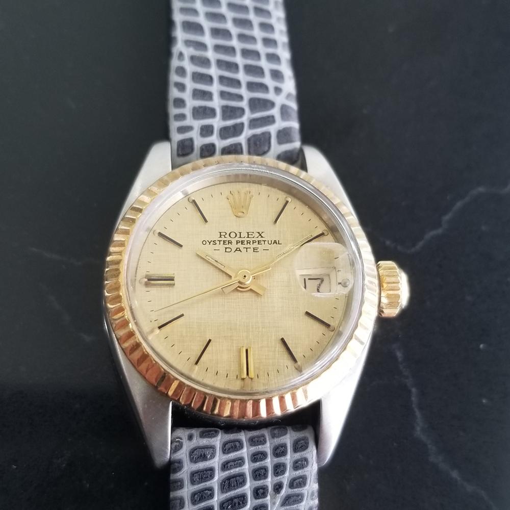Luxurious icon, Ladies 18K gold and stainless steel Rolex Oyster Perpetual Date Ref.6917 automatic, c.1974. Verified authentic by a master watchmaker. Gorgeous Rolex-signed gold linen dial, applied gold/black baton hour markers, date display at the