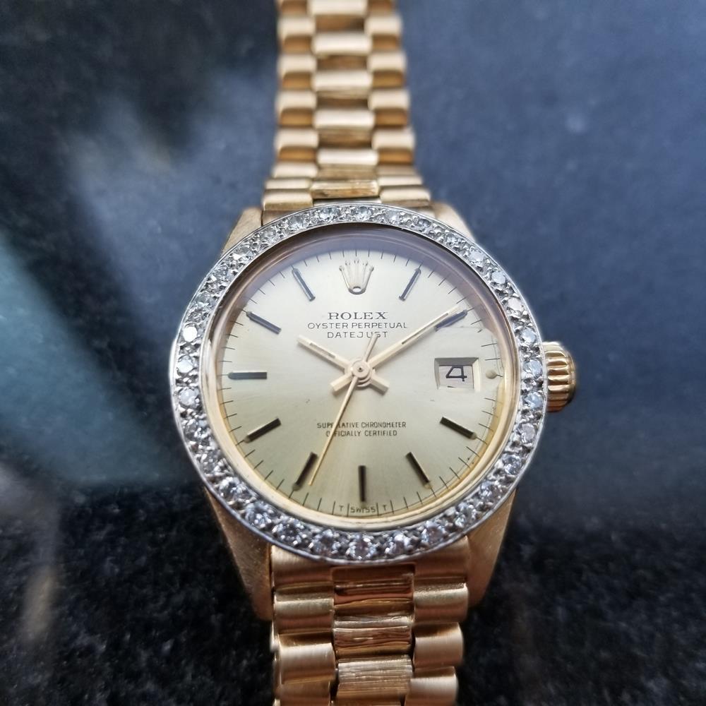 Timeless luxury, Ladies 18K gold Rolex Oyster Datejust automatic with dazzling diamond bezel, c.1975. Verified authentic by a master watchmaker. Gorgeous Rolex-signed gold dial, applied indice hour markers, date display at the 3 position, gold