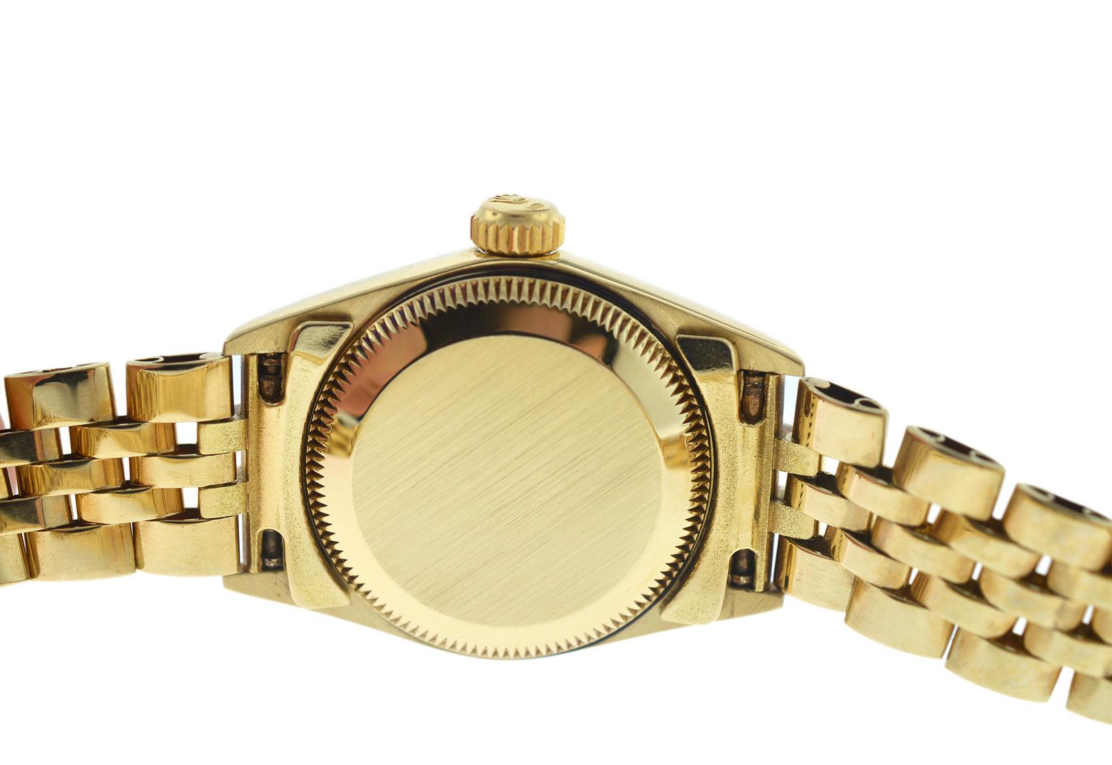 Ladies Rolex Oyster Perpetual 14 Karat Yellow Gold Diamond Dial Watch In Excellent Condition For Sale In New York, NY