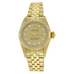 Ladies Rolex Oyster Perpetual 67197 14 Karat Yellow Gold Diamond Dial Watch
