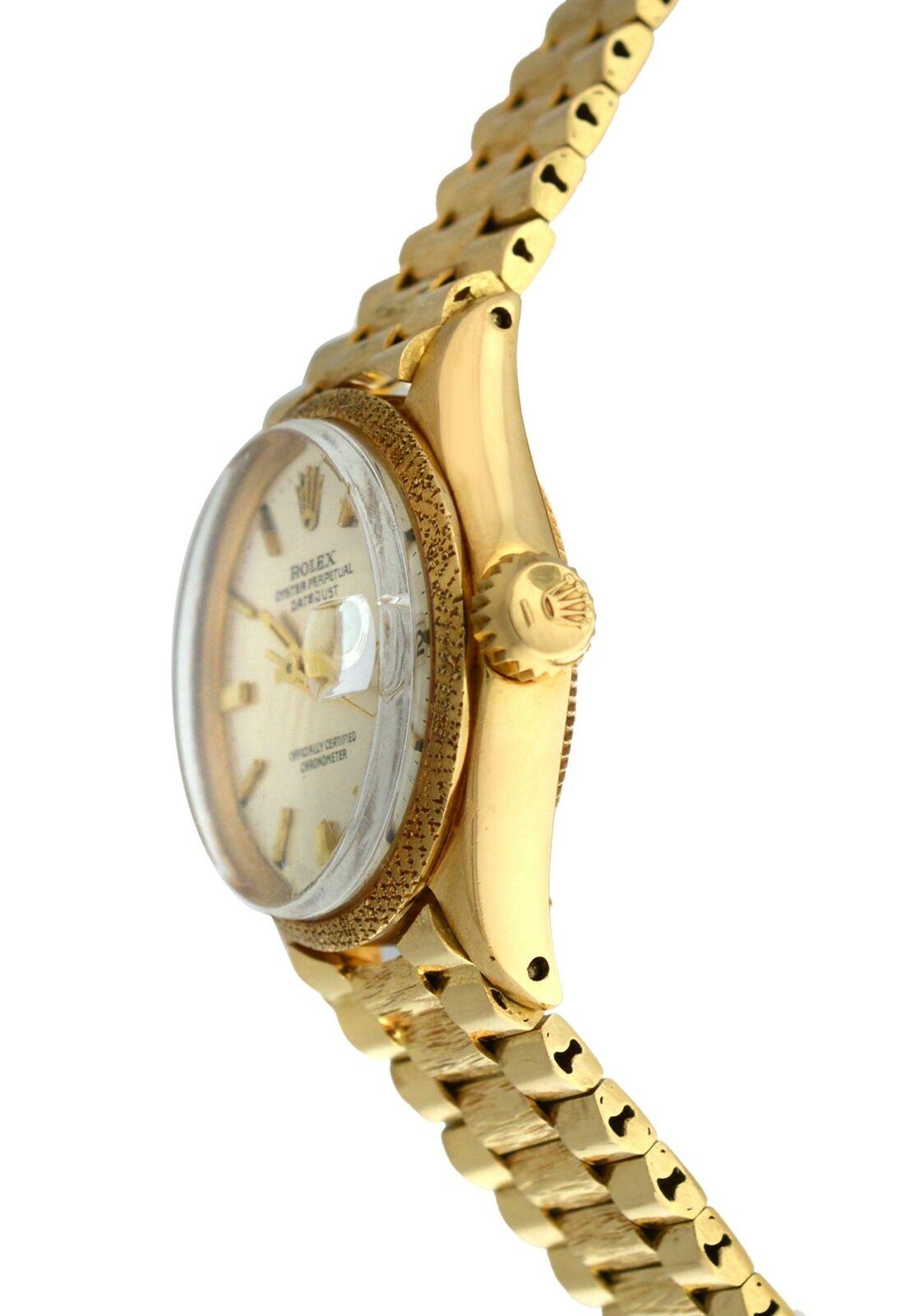 
Brand	Rolex
Model	Oyster Perpetual Date Just 6701
Gender	Ladies
Condition	Pre-owned
Movement	Swiss automatic
Case Material	18K Yellow Gold
Bracelet / Strap Material	
18K Yellow Gold

Clasp / Buckle Material	
18K Yellow Gold	
Clasp