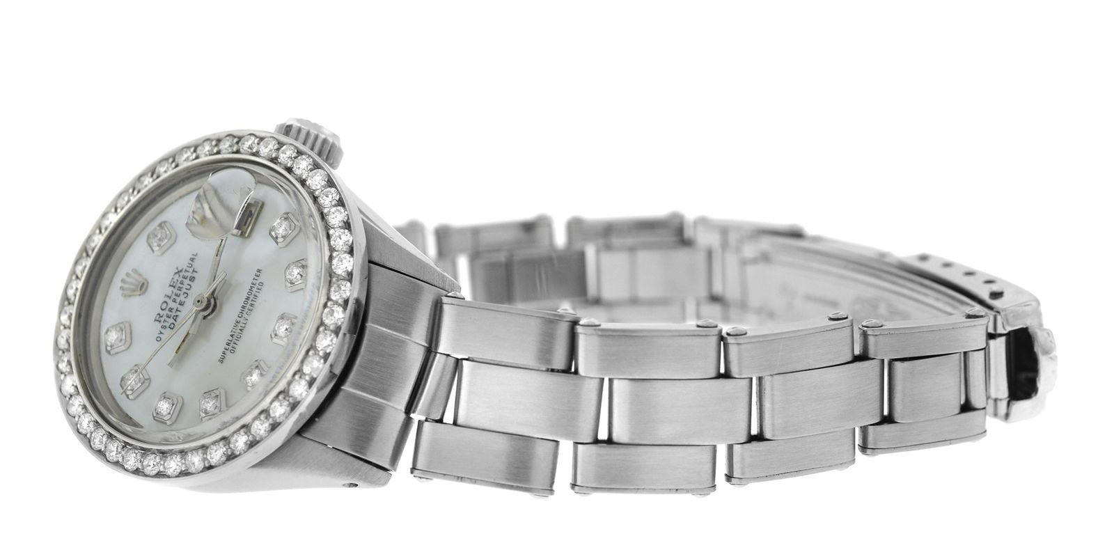 Brand	Rolex
Model	Oyster Perpetual Date 6516
Gender	Ladies
Condition	Pre-owned
Movement	Swiss automatic
Case Material	Stainless Steel & Diamond Bezel
Bracelet / Strap Material	
Stainless Steel 

Clasp / Buckle Material	
Stainless Steel 

Clasp