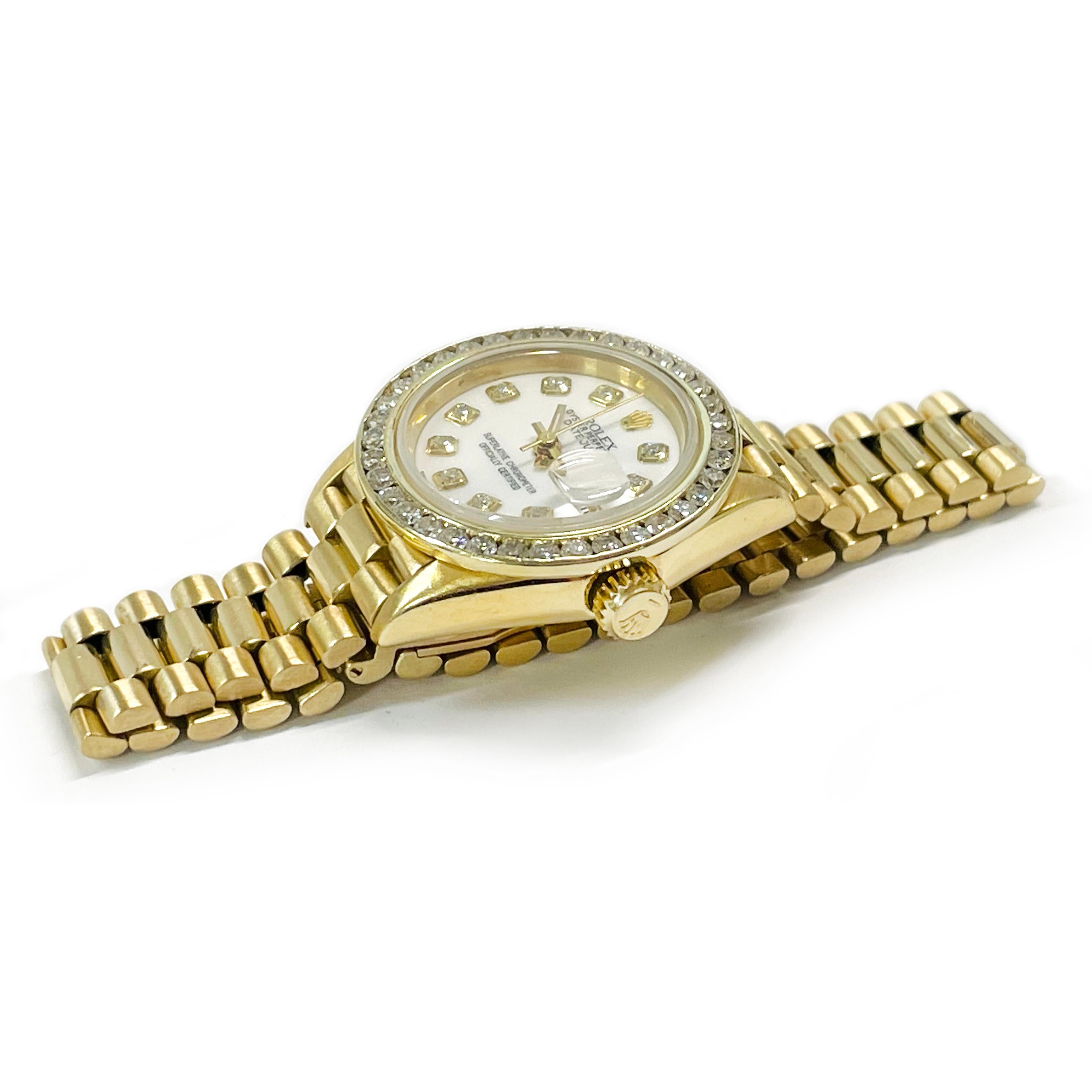 Ladies Rolex Oyster Perpetual Datejust Diamond Bezel Watch, 1954. Beautiful iconic wristwatch with a white dial, gold hour, minute, and second hand, diamond hours, and diamond bezel. There are thirty-six 1.8mm round pave-set diamonds set on the