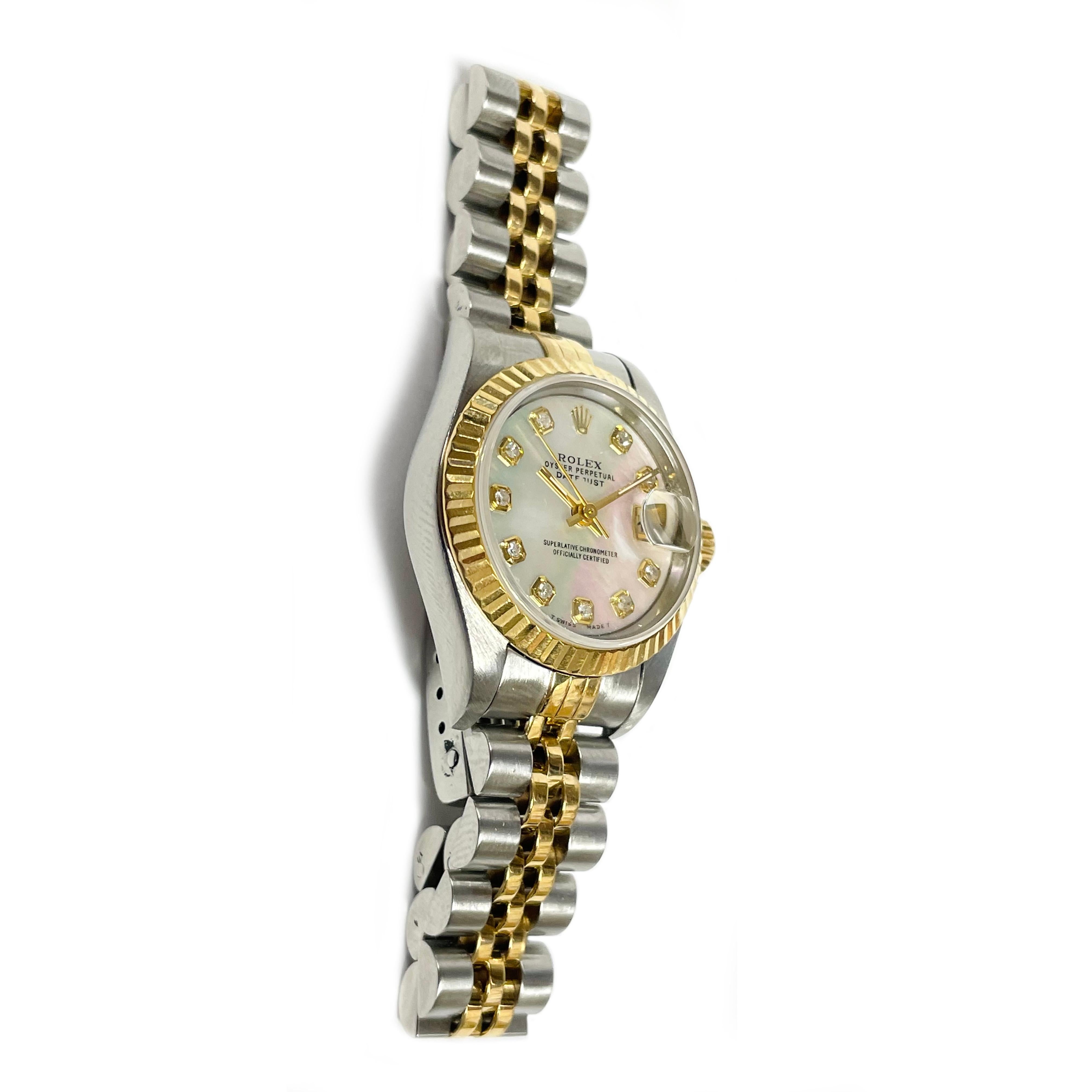 Rolex Lady's Datejust Watch with Fluted Bezel, 1996. The serial number is 69173, and the model number is T866989. The movement #2135. The is an 18-karat yellow gold fluted bezel, sapphire crystal, and superlative chronometer movement. There are ten
