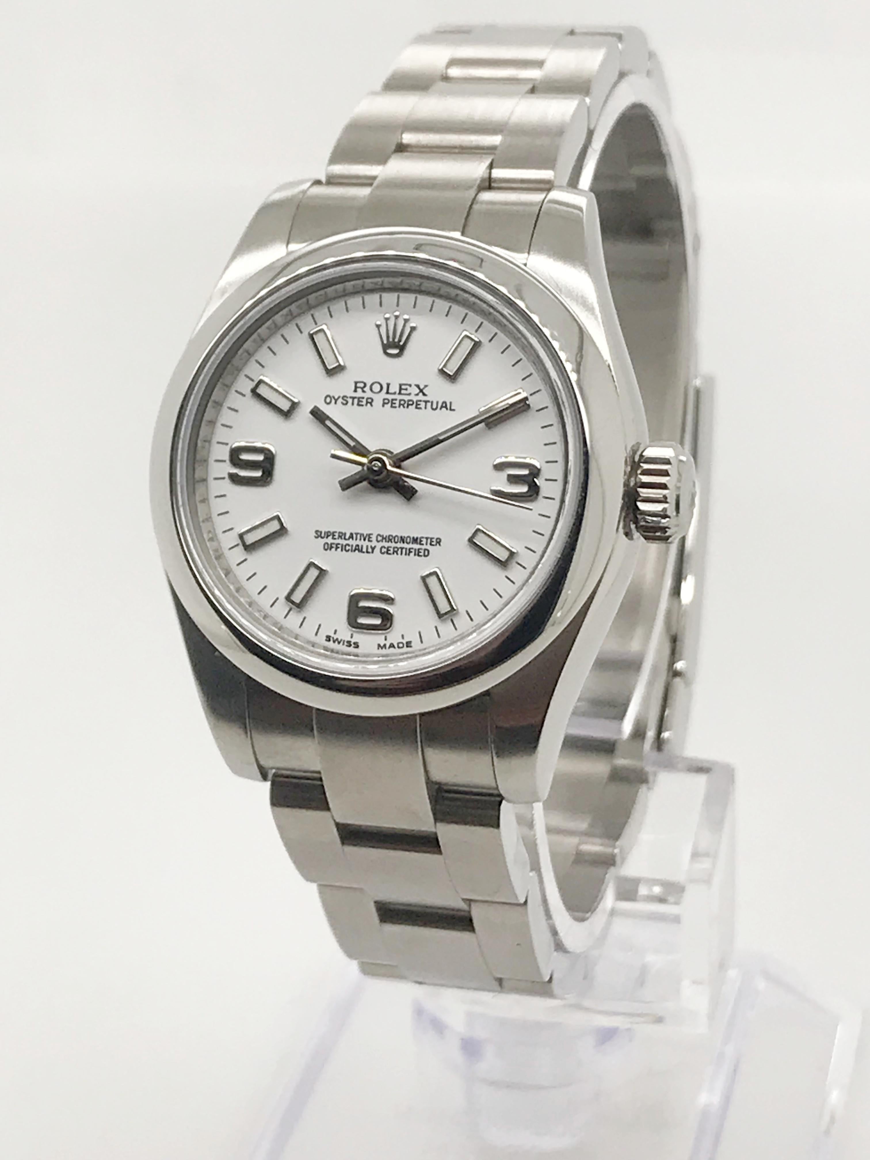 The ladies oyster perpetual is Rolex's most classic model. This watch is sold with its original box and informational card. 

This timepiece was recently serviced and authenticated by a Rolex certified watchmaker.