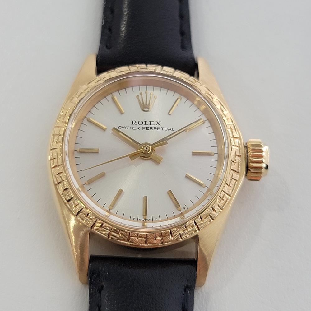 Timeless luxury, Ladies 18k solid gold Rolex Oyster Perpetual automatic dress watch, c.1967, in pristine condition with special, rare etched bezel by Rolex. Verified authentic by a master watchmaker. Gorgeous Rolex signed gilt dial, applied indice